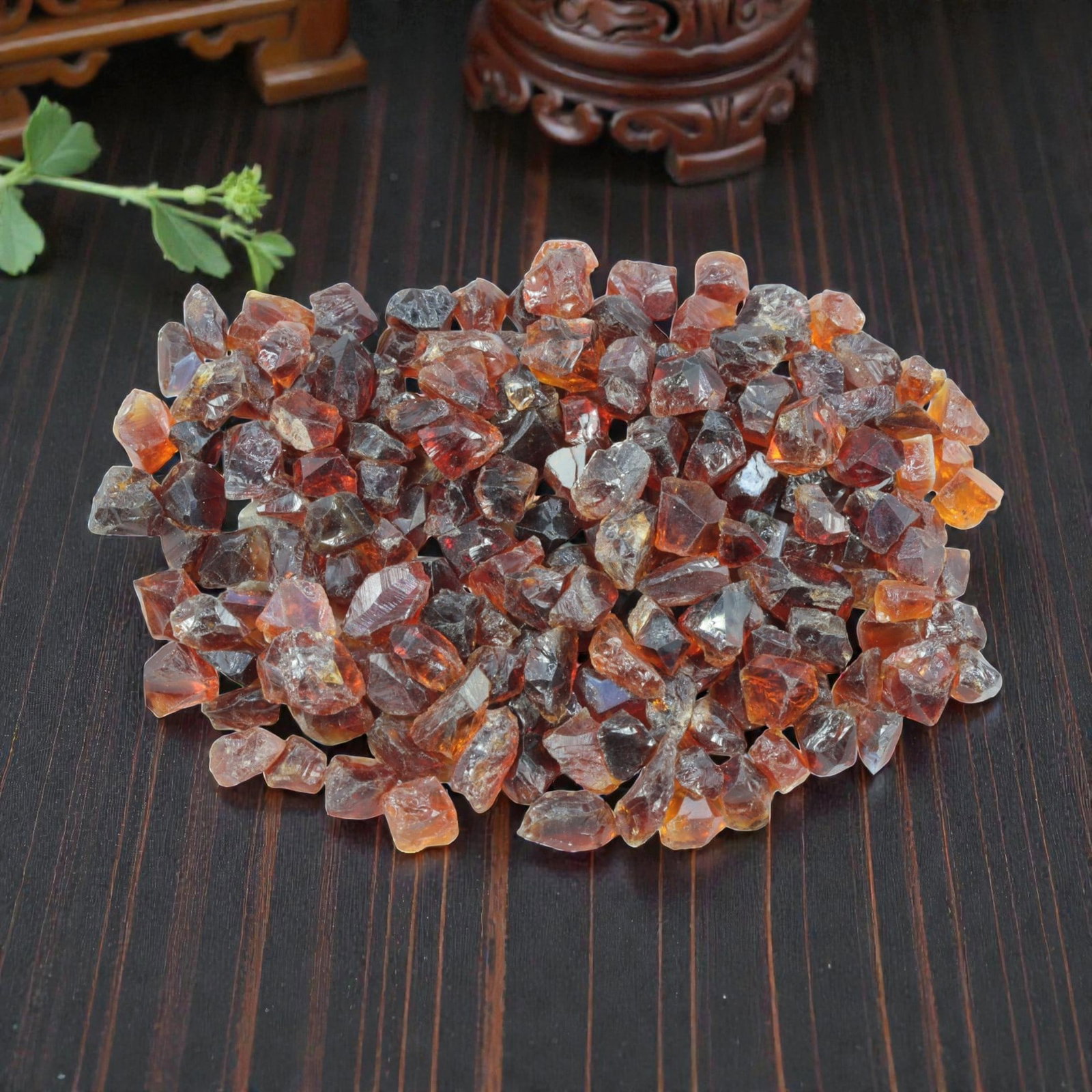 170.38 Carats Natural Garnet Rough Parcel, 38XE: This generous parcel of natural garnet rough showcases a rich palette of warm hues, ranging from deep reddish-brown to vibrant orange and honey tones. The stones are in their natural crystalline form,