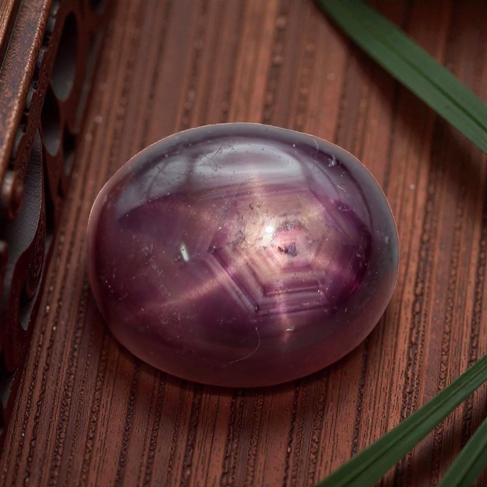 5.79 Carats Deep Purple-Red Star Ruby Oval Cabochon - Natural Loose Gemstone, 6XC: This striking star ruby features a rich, deep purple-red hue, evoking the depth of aged wine with subtle magenta undertones that shift under light. A vivid six-rayed star glides gracefully across its 