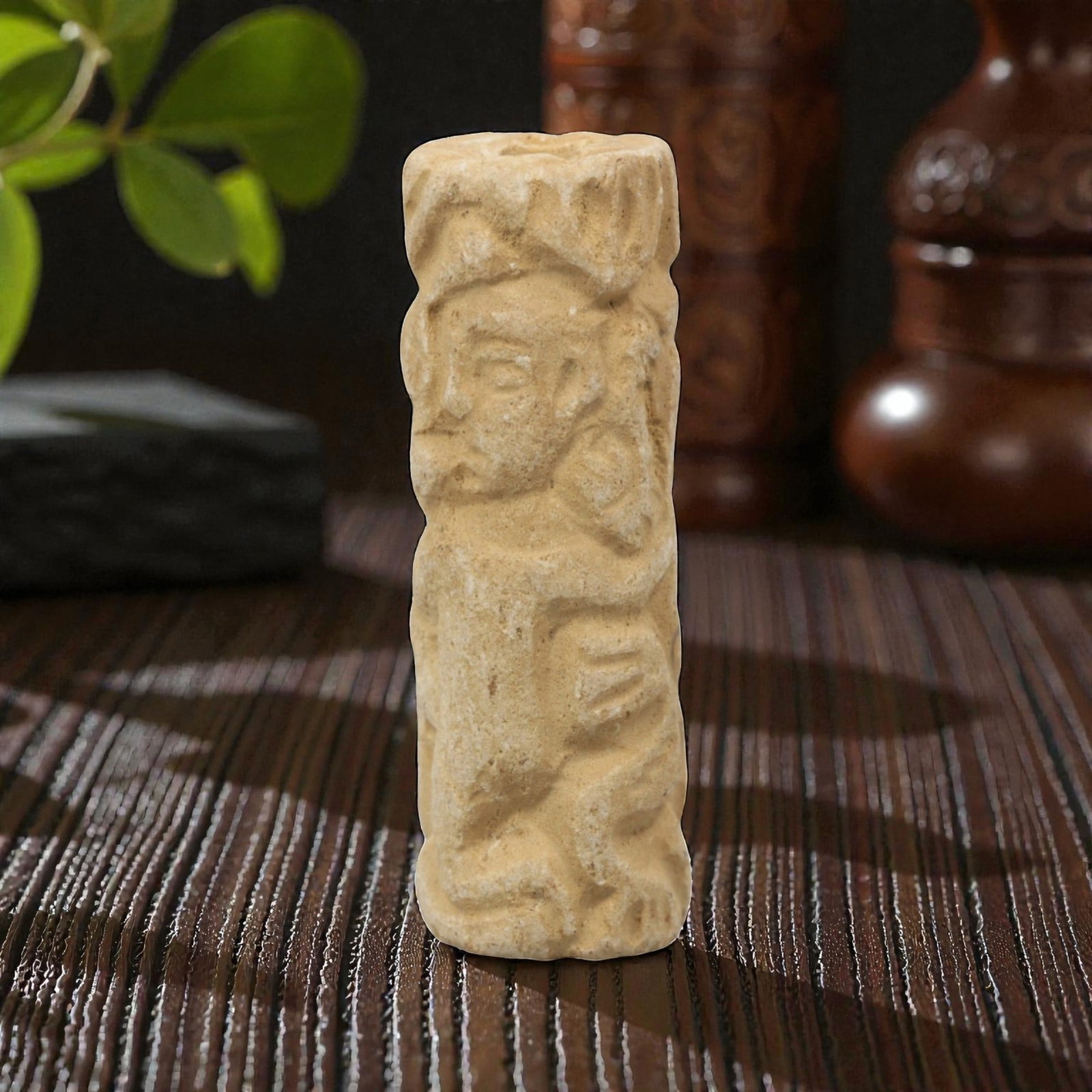 Ancient Limestone Cylinder Bead - Carved Relief, 76ZQ: Carved from limestone, this ancient cylinder bead features a finely executed carved relief with a stylized humanoid form, characteristic of Near Eastern glyptic art. The carving displays fine detail i