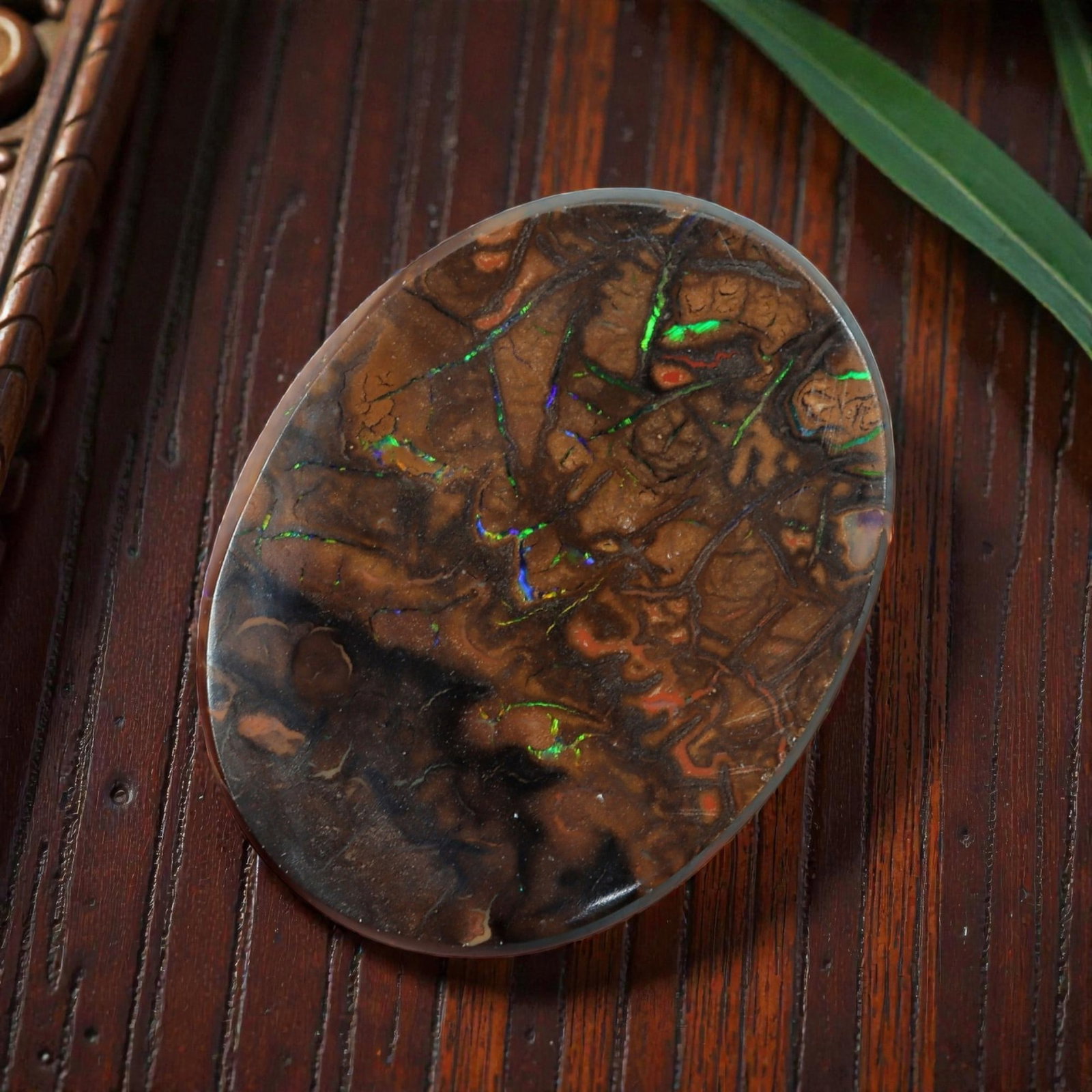 3.85 Carats Koroit Yowah Opal Cabochon - Natural Australian Single Stone, 74XL: This striking Koroit Yowah opal cabochon, measuring 12.5x10mm, features a dense, textured ironstone matrix in layered tones of deep chocolate brown, warm tan, and jet black. The stone's internal lands