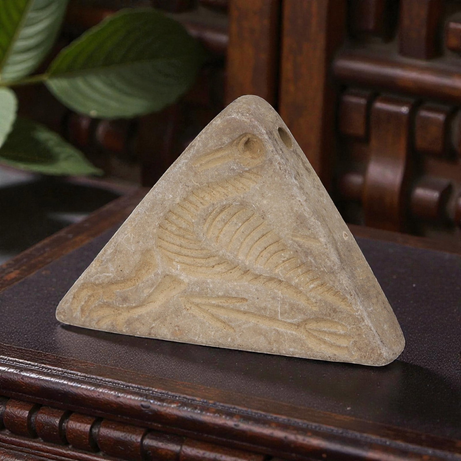 Antique Silk Road Schist Zoomorphic Amulet Pendant, 51YD: This ancient amulet pendant is carved from weathered light beige schist, with a triangular form and suspension hole at the apex. The face features a deeply engraved zoomorphic motif depicting a styliz