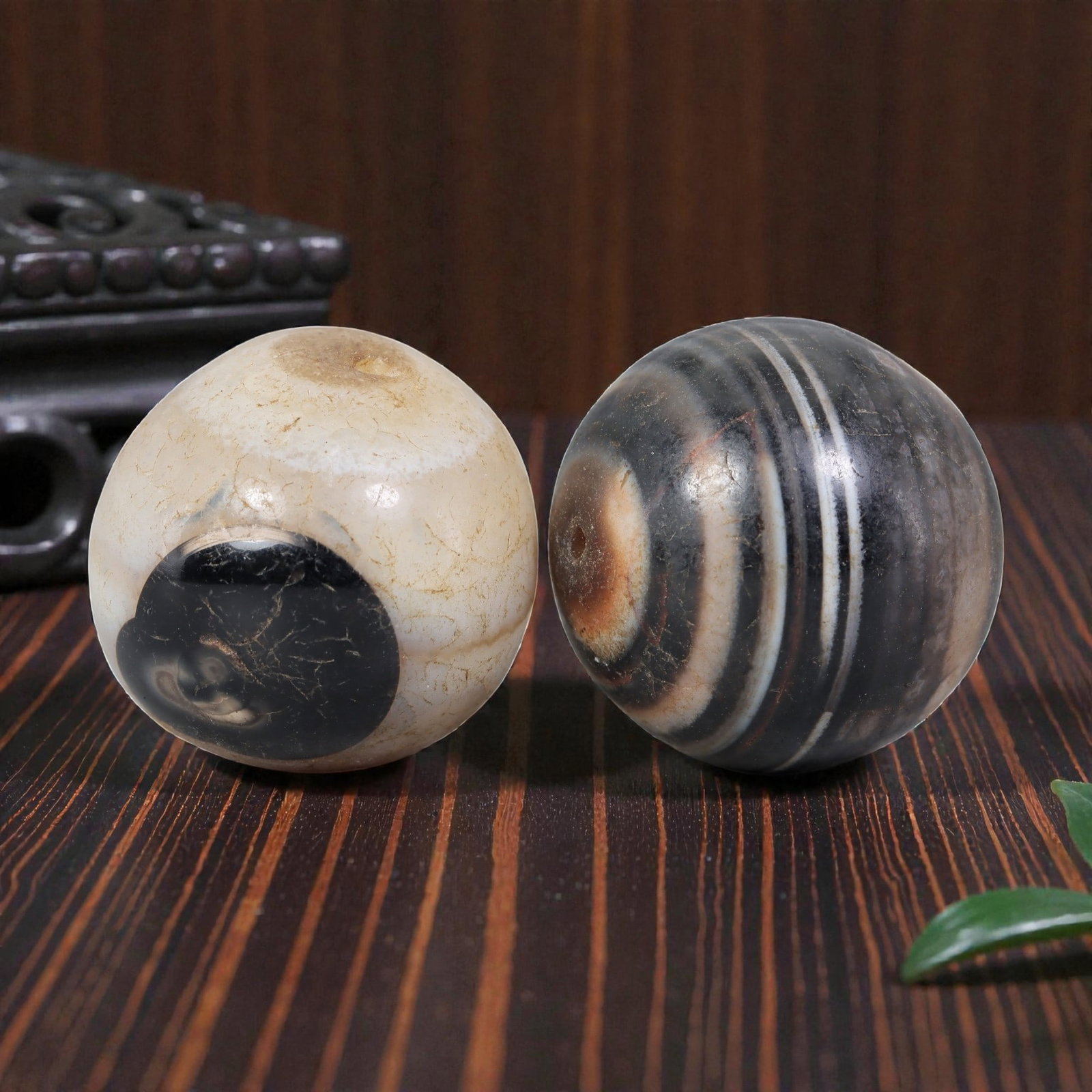 Antique Tibetan Agate Bead Pair - Banded Guru Dzi Beads, 64EB: These paired beads are crafted from natural banded agate, exhibiting distinct concentric striations and contrasting dark and light patterns. The surfaces display visible age-related patina, fine crack
