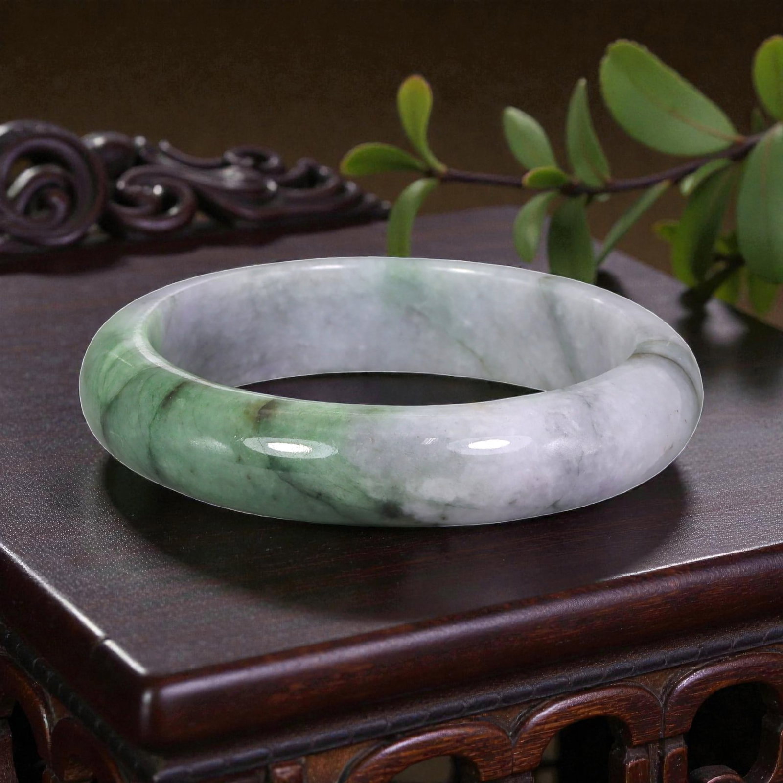 Natural Burmese Type A White & Green Jadeite Bangle - Verdant Accent Bracelet, 7EA: This is a wide, solid bangle crafted from natural Burmese Type A jadeite, displaying a milky white base with vivid, verdant green patterning that flows naturally across the stone. The surface exhibits