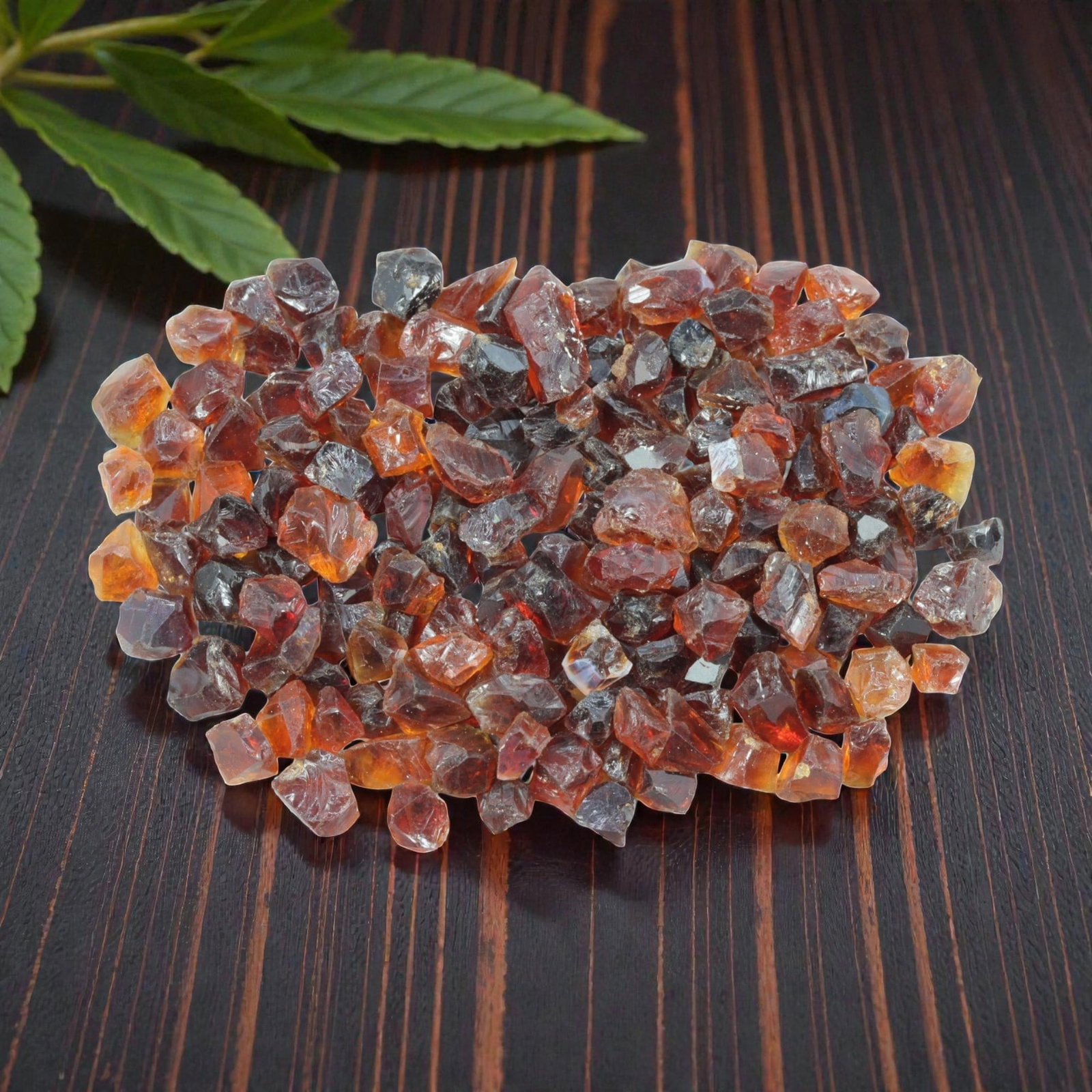147.36 Carats Natural Garnet Rough Parcel, 40XE: This substantial parcel of natural garnet rough showcases a rich, warm spectrum of hues, from deep reddish-brown and burgundy to vibrant amber and honey-orange tones. The stones are in their raw, crys