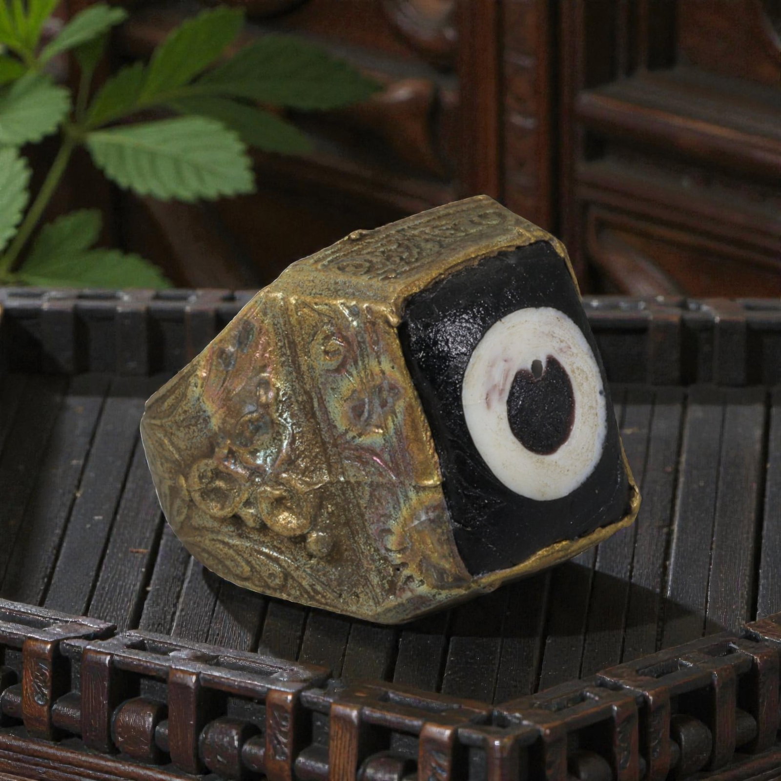 Antique Qajar Dynasty Gilt Evil Eye Ring, US Size 10, 54AJ: A gilt-metal ring of the Qajar period, US ring size 10, featuring a large square evil-eye glass inlay with a classic black, white, and dark concentric design set into a faceted bezel. The wide band is