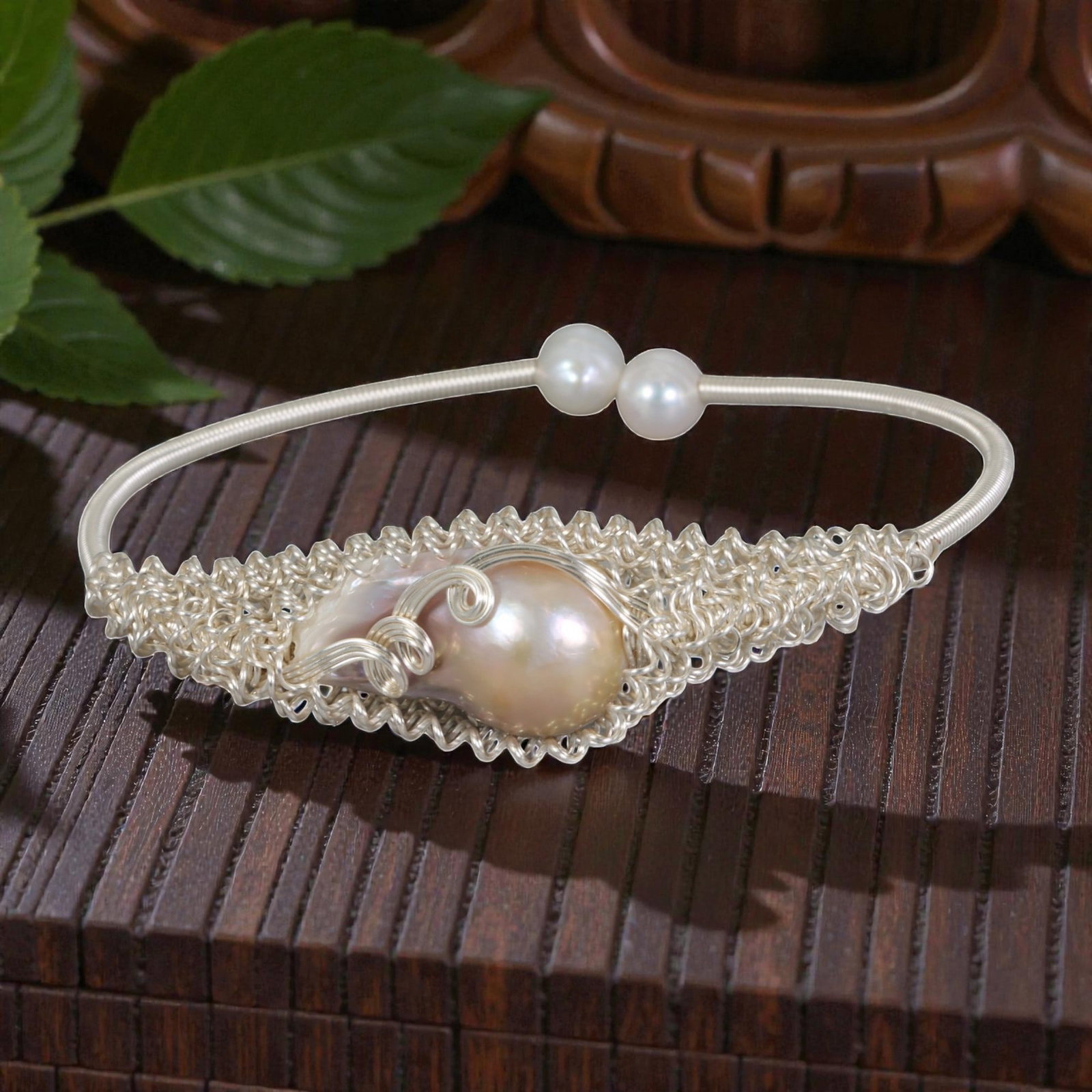 Natural Freshwater Baroque Pearl Silver Tone Wire-Woven Open Cuff Bracelet, 20EB: A handcrafted open cuff bracelet made with silver-toned wire, featuring a large natural freshwater baroque pearl at the center set within an intricate lace-like woven wire frame. The pearl is accented