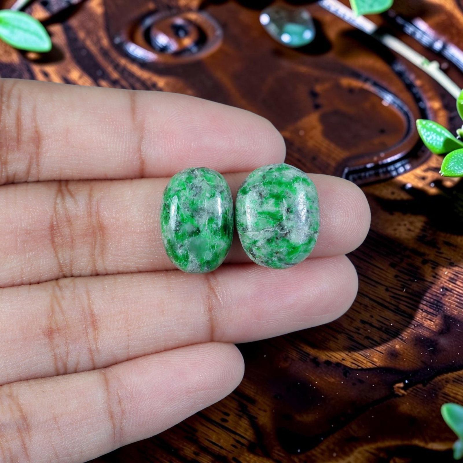 13.82ct Natural Burmese Type A Jadeite Jade Cabochon Pair, 15EC: Crafted as a matched pair from untreated natural Type A Burmese jadeite jade, each piece is finished as a smoothly domed oval cabochon with flat base suited for earring mounting. The mineral matrix fe