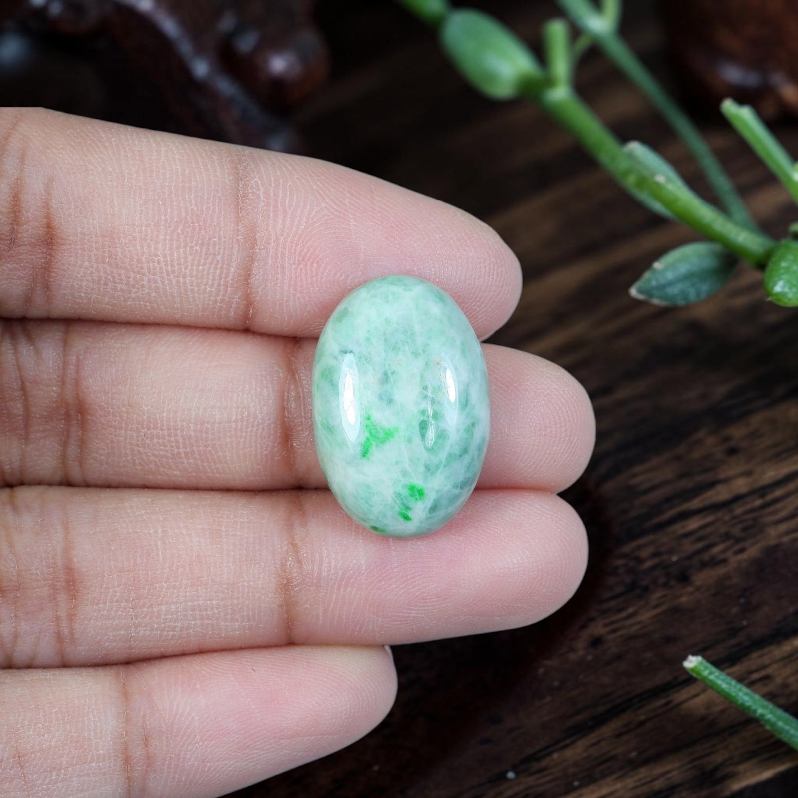 13.21ct Natural Burmese Type A Jadeite Jade Cabochon, 91EB: Polished from untreated natural Burmese Type A jadeite jade, this compact oval cabochon features smoothly domed top and flat base engineered for ring setting. Pale milky celadon base matrix bears a sm