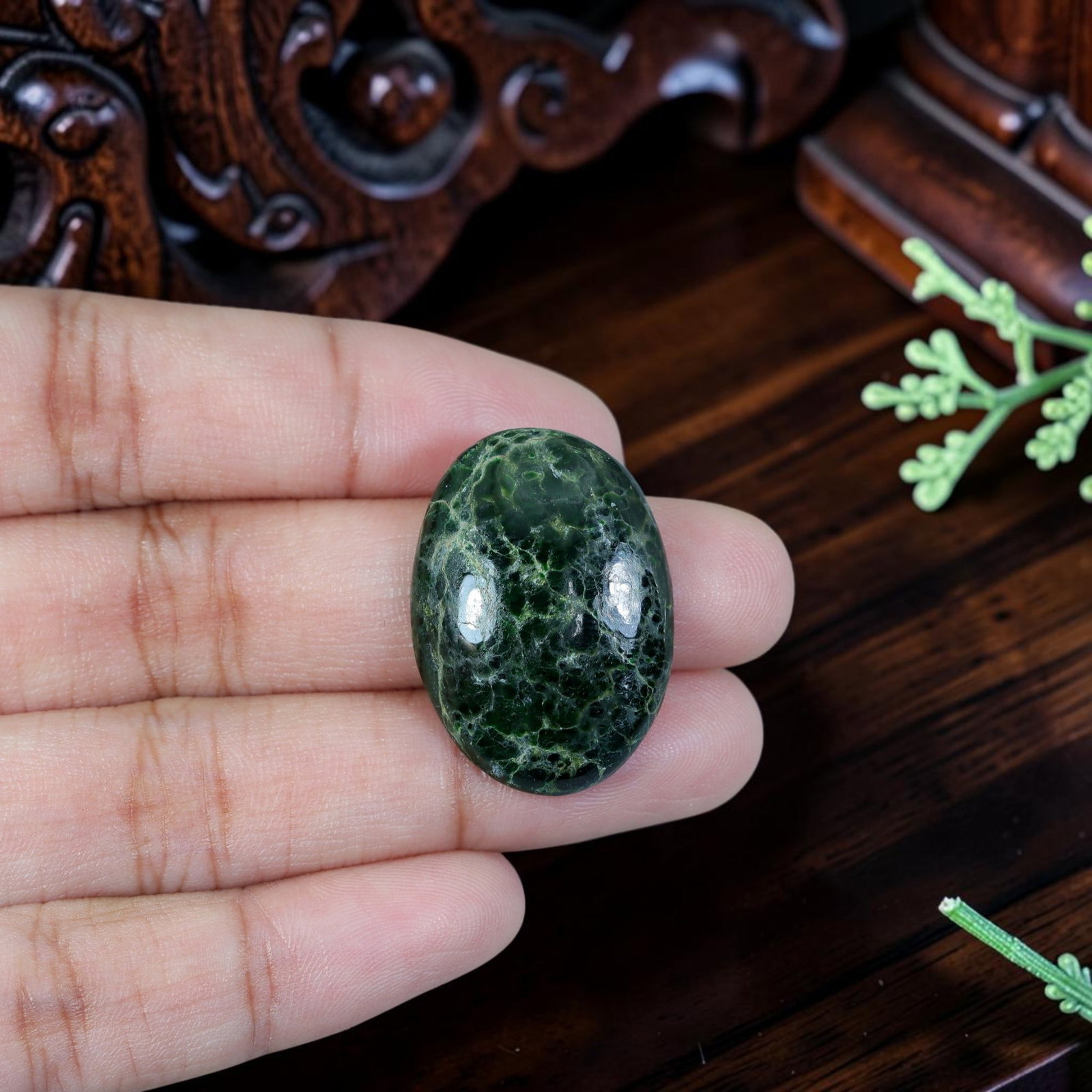 20.90ct Natural Burmese Type A Jadeite Jade Cabochon, 7EC: Polished from untreated natural Burmese Type A jadeite jade, this mid-size oval cabochon features smooth domed top and thin flat base for ring or petite pendant setting. Deep moss green matrix is full