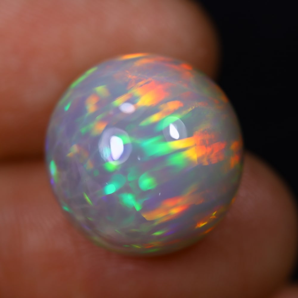 *11.62Ct Welo Opal Polished - Ethiopian Opal , 535E: Ksmith Heritage Auctioneers Subject: Natural Ethiopian Welo Opal Origin: Ethiopia Carat Weight: 11.62Ct Dimension: 15.2x15x9.7 mm Treatment: Natural Untreated Type: Caboch