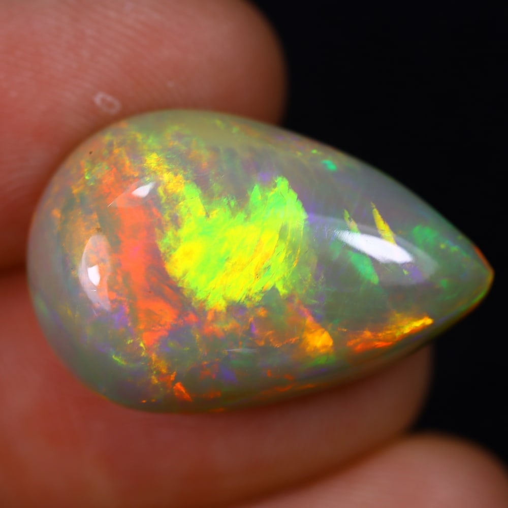 *12.84Ct Welo Opal Polished - Ethiopian Opal , 18E: Ksmith Heritage Auctioneers Subject: Natural Ethiopian Welo Opal Origin: Ethiopia Carat Weight: 12.84Ct Dimension: 22.5x14.9x8.3 mm Treatment: Natural Untreated Type: Face