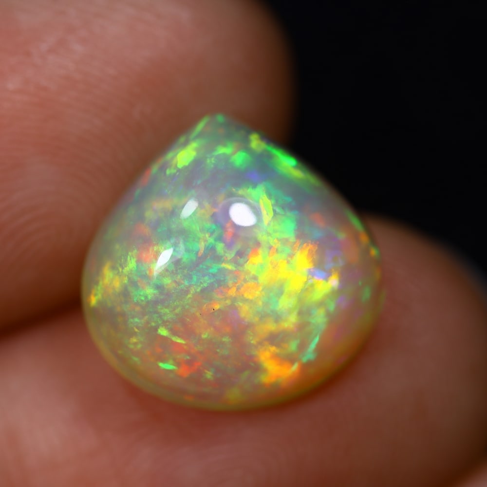 *4.26Ct Welo Opal Polished - Ethiopian Opal - Pear Cabochon, 696B: Ksmith Heritage Auctioneers Subject: Natural Ethiopian Welo Opal Origin: Ethiopia Carat Weight: 4.26Ct Dimension: 12.7 x 12.4 x 6.1 mm Treatment: Natural Untreated Shape: Pear