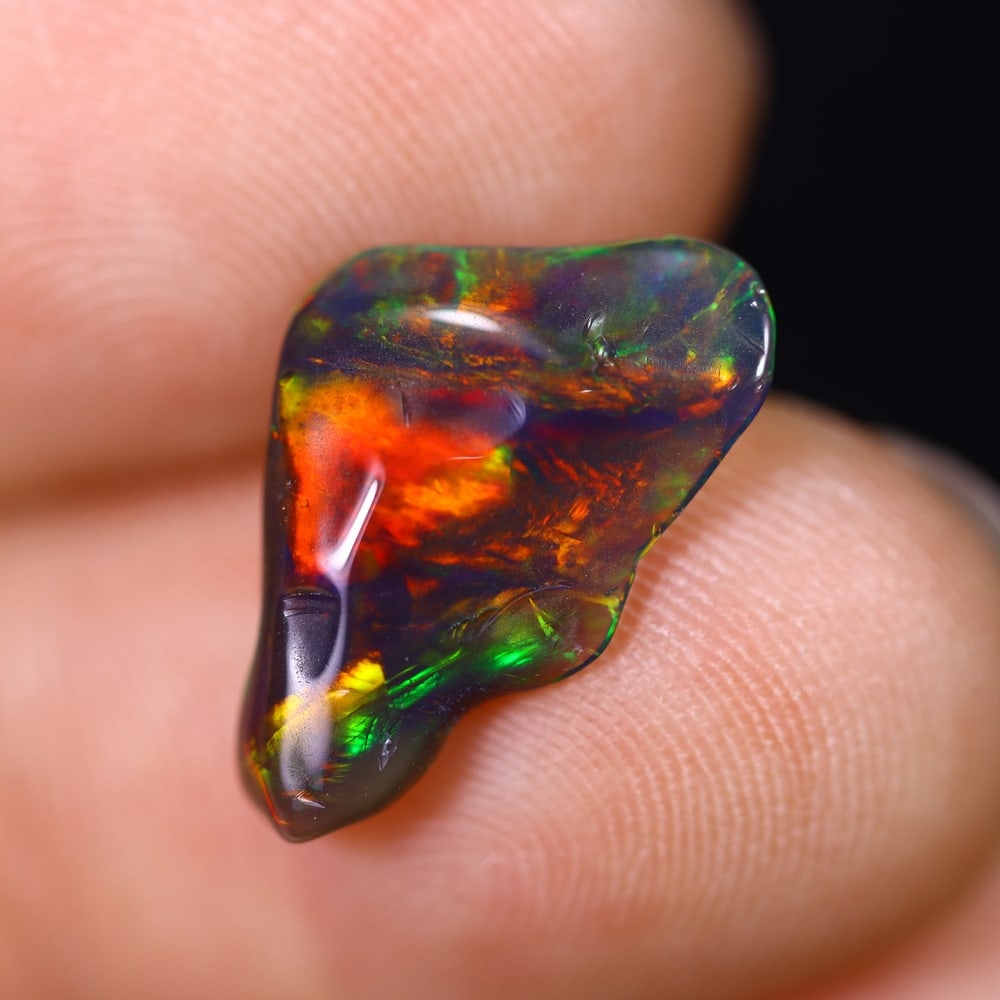 *1.68Ct Smoked Freeform Welo Opal Polished - Ethiopian Opal , 201C: Ksmith Heritage Auctioneers Subject: Natural Ethiopian Welo Opal Origin: Ethiopia Carat Weight: 1.68Ct Dimension: 13.2x10.9x3.2 mm Treatment: Smoked Type: Freeform, Polish