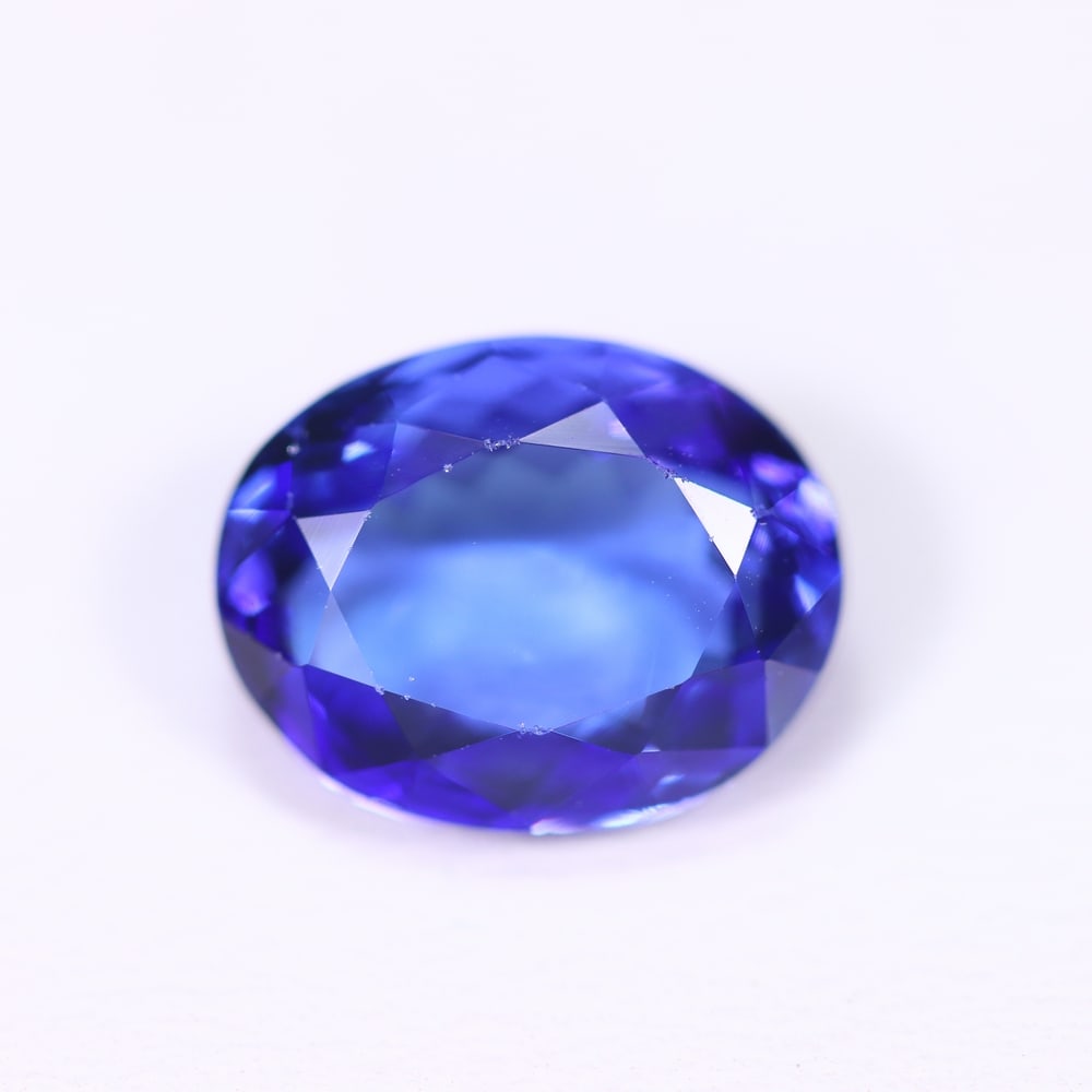 4.90Ct Tanzanite Faceted - Oval Polished , 768B: Ksmith Heritage Auctioneers Subject: Natural Tanzanite Origin: Tanzania Dimension: 11.6x9.1x5.5 mm Treatment: Heated Shape: Oval Type: Faceted, Polished