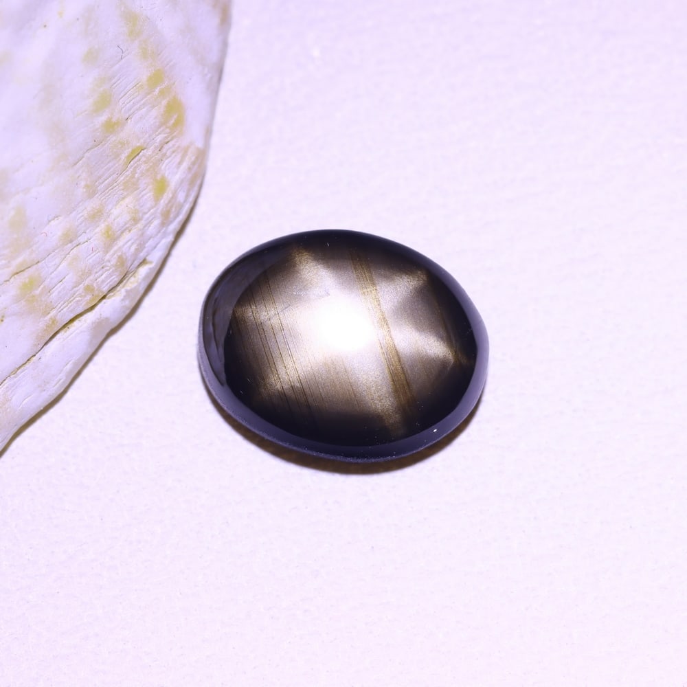 2.25cts 6 Rays Black Star Sapphire , 1018B: Ksmith Heritage Auctioneers Subject: Natural 6 Rays Star Sapphire Origin: Myanmar Carat Weight: 2.25cts Dimension: 8.8x7x2.9 mm Treatment: Diffusion Type: Cabochon, Polished