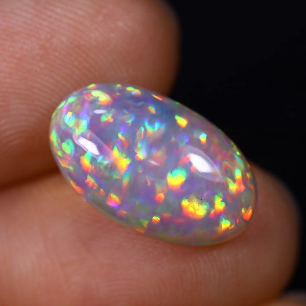 *4.98Ct Welo Opal - Ethiopian Opal, 379C: Ksmith Heritage Auctioneers Subject: Natural Ethiopian Welo Opal Origin: Ethiopia Carat Weight: 4.98Ct Dimension: 16.6x9.9x5.4 mm Treatment: Natural Untreated Type: Cabochon, P