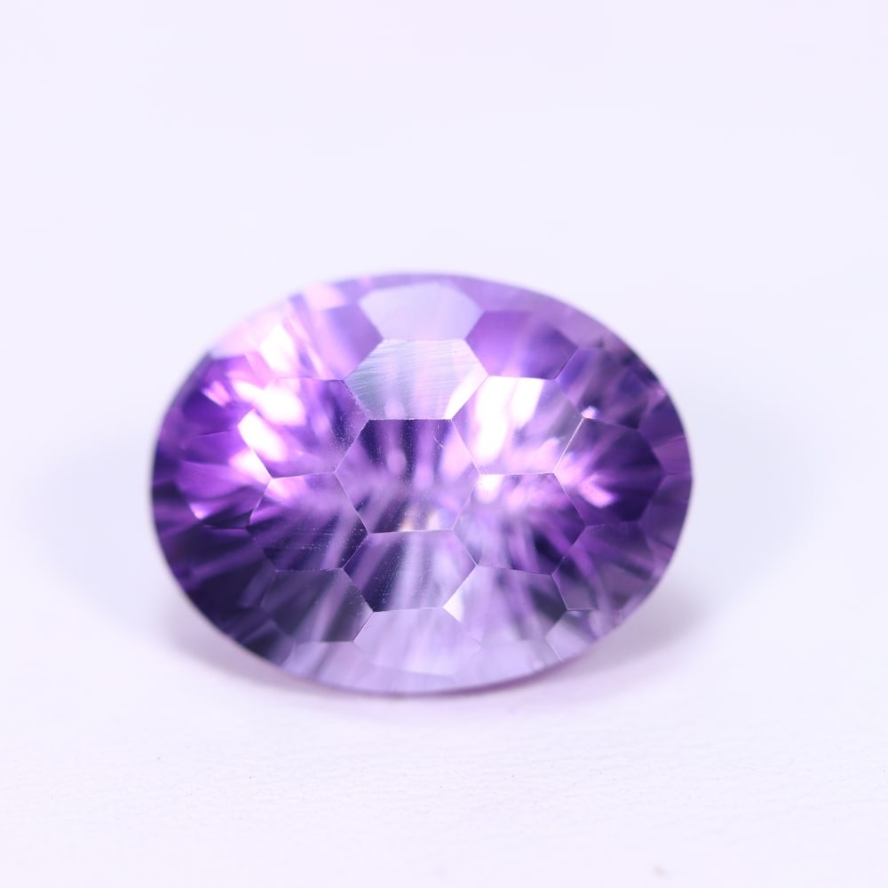 10.83Ct Purple Amethyst - Polished Faceted, 960B: Ksmith Heritage Auctioneers Subject: Natural Amethyst Origin: Brazil Carat Weight: 10.83Ct Dimension: 16.4x12.7x10.4 mm Treatment: Untreated Type: Faceted, Polished