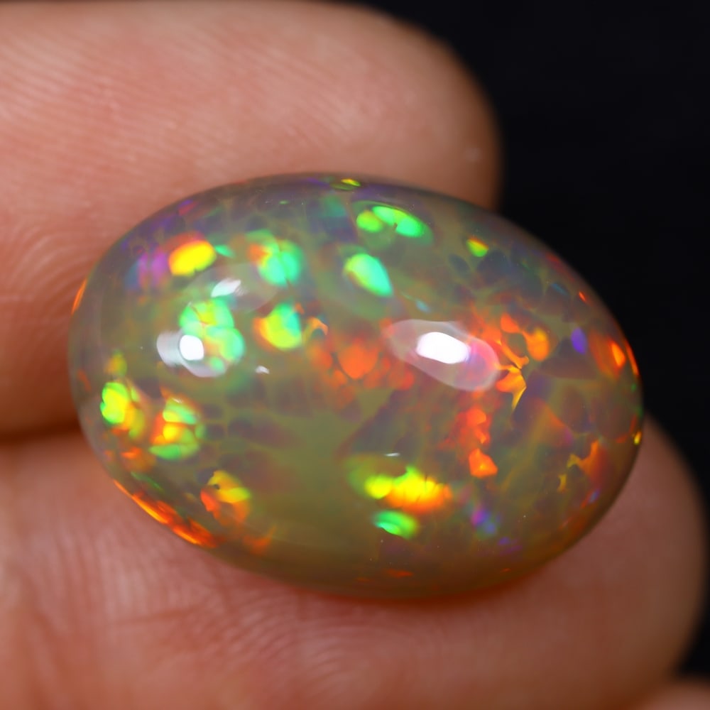 *11.85Ct Welo Opal Polished - Ethiopian Opal , 477E: Ksmith Heritage Auctioneers Subject: Natural Ethiopian Welo Opal Origin: Ethiopia Carat Weight: 11.85Ct Dimension: 19.5x14x8.8 mm Treatment: Natural Untreated Type: Caboch