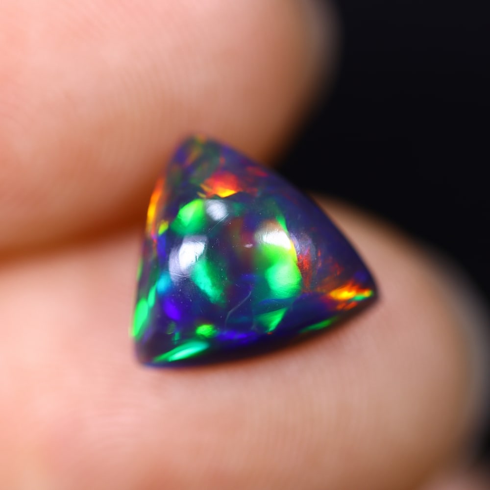 *1.97Ct Smoked Welo Opal Polished - Ethiopian Opal , 309C: Ksmith Heritage Auctioneers Subject: Natural Ethiopian Welo Opal Origin: Ethiopia Carat Weight: 1.97Ct Dimension: 9.7x9.4x4.8 mm Treatment: Smoked Type: Cabochon, Polished