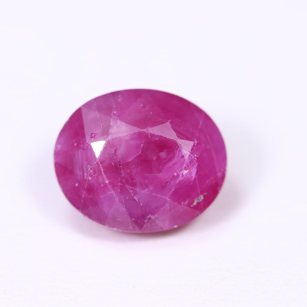 6.02Ct Red Ruby - Polished Faceted , 611E: Ksmith Heritage Auctioneers Subject: Natural Ruby Origin: Burma Carat Weight: 6.02Ct Dimension: 11.1x9.2x6.7 mm Treatment: Heated Type: Faceted, Polished