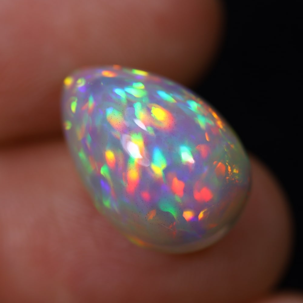 *7.51Ct Welo Opal Polished - Ethiopian Opal, 245B: Ksmith Heritage Auctioneers Subject: Natural Ethiopian Welo Opal Origin: Ethiopia Carat Weight: 7.51Ct Dimension: 16.6x11.1x8.5 mm Treatment: Natural Untreated Type: Cabochon,