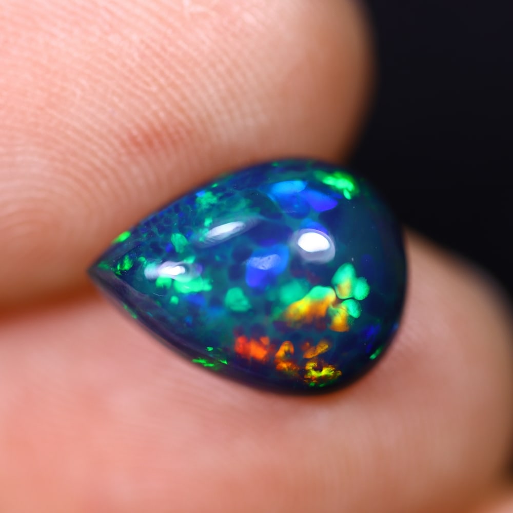 *2.60Ct Smoked Welo Opal Polished - Ethiopian Opal , 311C: Ksmith Heritage Auctioneers Subject: Natural Ethiopian Welo Opal Origin: Ethiopia Carat Weight: 2.60Ct Dimension: 12x9x5.1 mm Treatment: Smoked Type: Cabochon, Polished