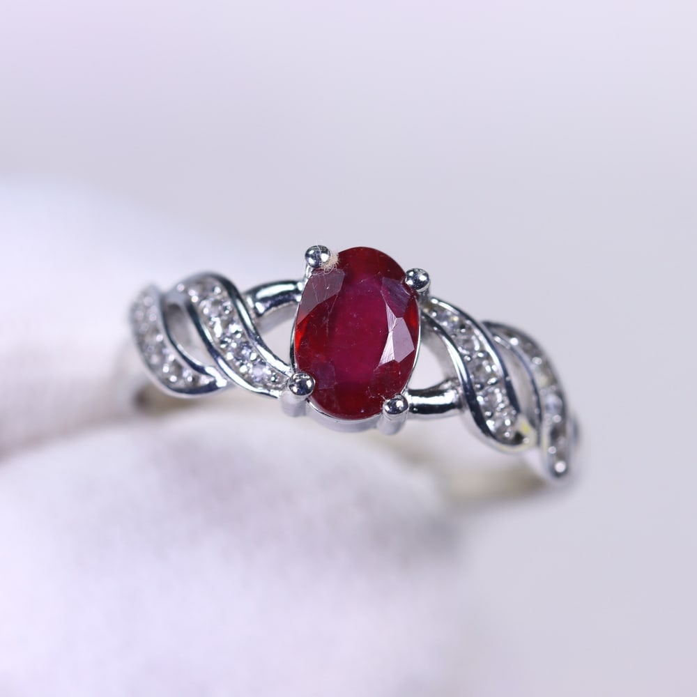 Ring US6.75 Ruby & Zircon - 925 Sterling Silver, 111B: Ksmith Heritage Auctioneers Subject: Natural Ruby & Zircon Origin: Thailand Carat Weight: 12.95ct Dimension: Gemstone 5x7mm Type: Ring