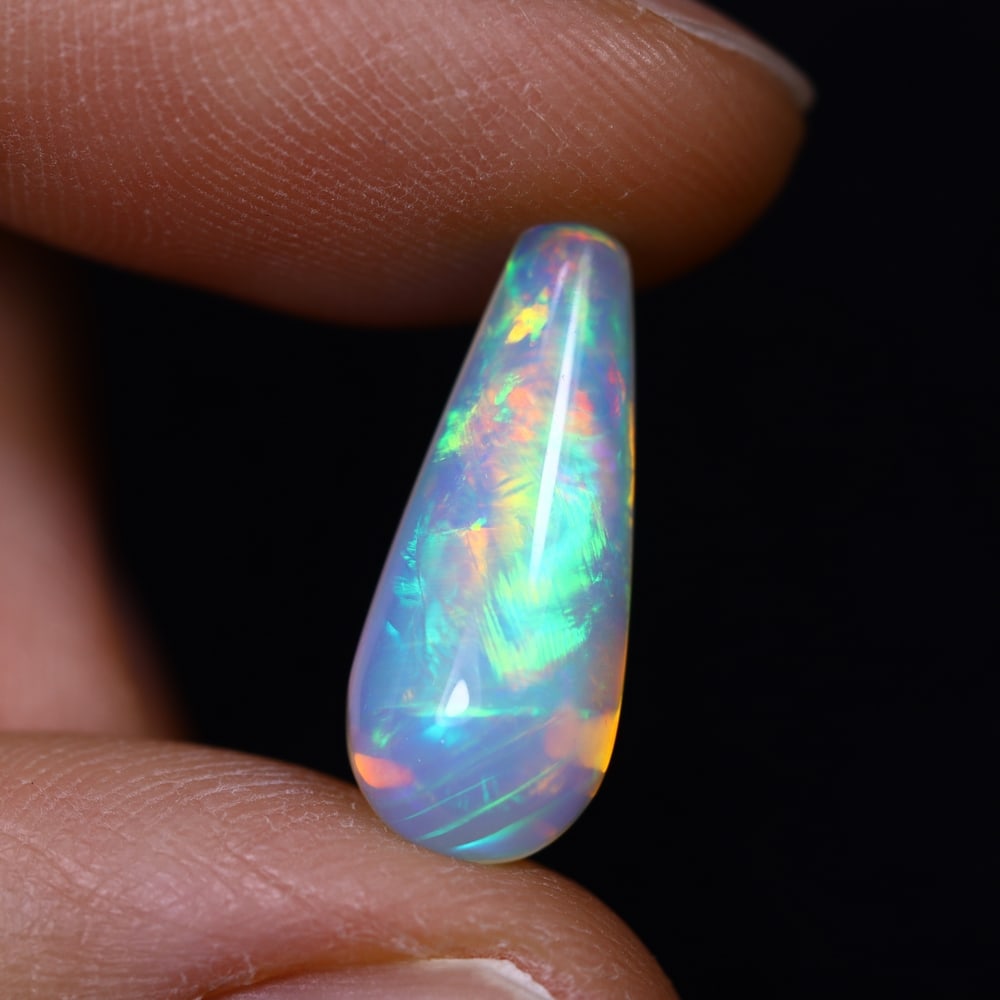 *3.85Ct Teardrop Welo Opal - Ethiopian Opal, 375C: Ksmith Heritage Auctioneers Subject: Natural Ethiopian Welo Opal Origin: Ethiopia Carat Weight: 3.85Ct Dimension: 17.6x7.3x7.3 mm Treatment: Natural Untreated Type: Cabochon, P