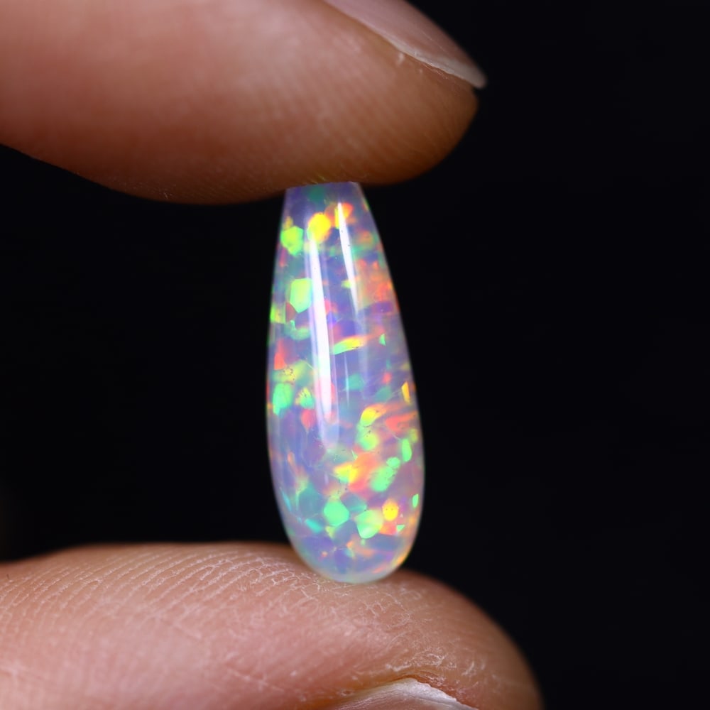 *3.07Ct Teardrop Welo Opal - Ethiopian Opal, 374C: Ksmith Heritage Auctioneers Subject: Natural Ethiopian Welo Opal Origin: Ethiopia Carat Weight: 3.07Ct Dimension: 15.7x6.2x5.9 mm Treatment: Natural Untreated Type: Cabochon, P