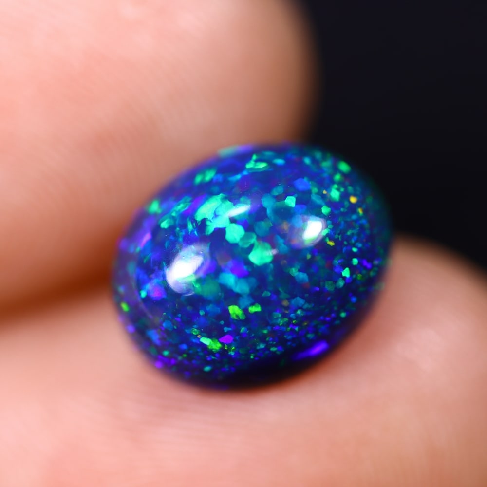 *2.93Ct Smoked Welo Opal Polished - Ethiopian Opal , 312C: Ksmith Heritage Auctioneers Subject: Natural Ethiopian Welo Opal Origin: Ethiopia Carat Weight: 2.93Ct Dimension: 11.1x9.1x5.6 mm Treatment: Smoked Type: Cabochon, Polishe
