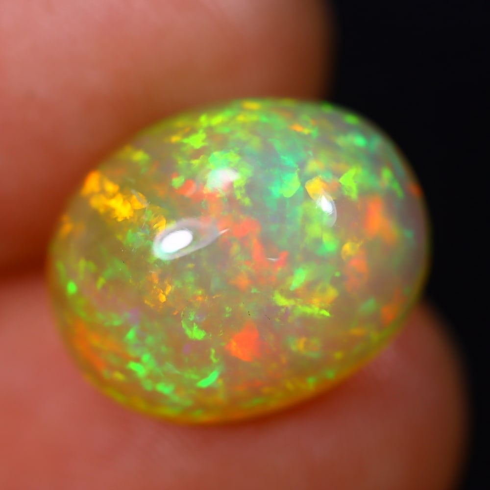 *4.95Ct Welo Opal Polished - Ethiopian Opal - Oval Cabochon, 328B: Ksmith Heritage Auctioneers Subject: Natural Ethiopian Welo Opal Origin: Ethiopia Carat Weight: 4.95Ct Dimension: 13.7 x 11 x 7.3 mm Treatment: Natural Untreated Shape: Oval