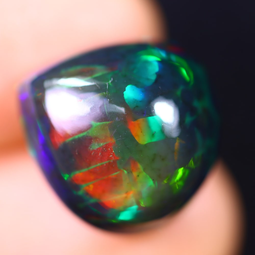 *8.66Ct Welo Black Opal Polished - Ethiopian Opal - Pear Cabochon , 46E: Ksmith Heritage Auctioneers Subject: Natural Ethiopian Welo Black Opal Origin: Ethiopia Carat Weight: 8.66Ct Dimension: 15.4 x 14.6 x 9 mm Treatment: Smoked Shape: Pear