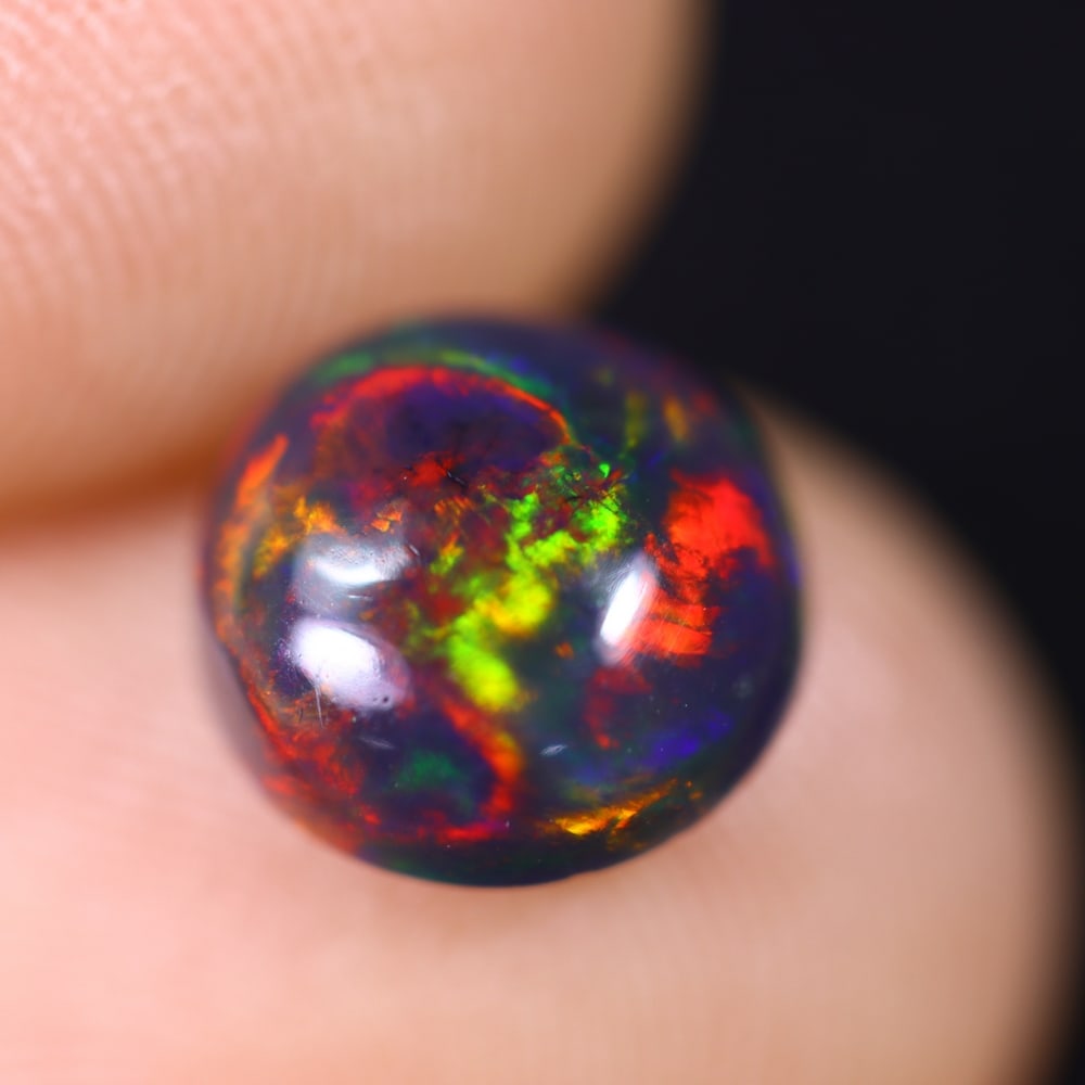 1.38Ct Welo Black Opal Polished - Ethiopian Opal , 559E: Ksmith Heritage Auctioneers Subject: Natural Ethiopian Welo Black Opal Origin: Ethiopia Carat Weight: 1.38Ct Dimension: 8.5x8.3x4 mm Treatment: Smoked Type: Cabochon, Poli