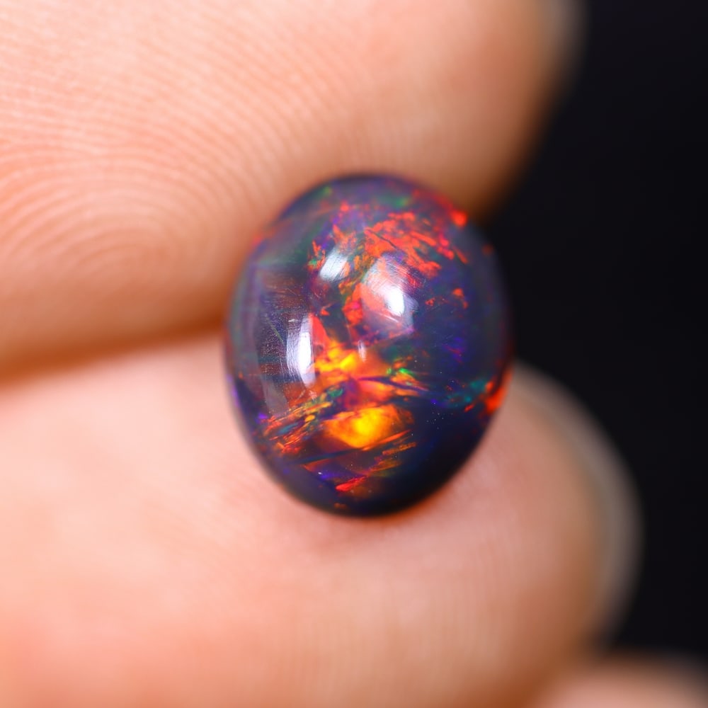*1.64Ct Smoked Welo Opal Polished - Ethiopian Opal , 304C: Ksmith Heritage Auctioneers Subject: Natural Ethiopian Welo Opal Origin: Ethiopia Carat Weight: 1.64Ct Dimension: 10x8.2x4 mm Treatment: Smoked Type: Cabochon, Polished