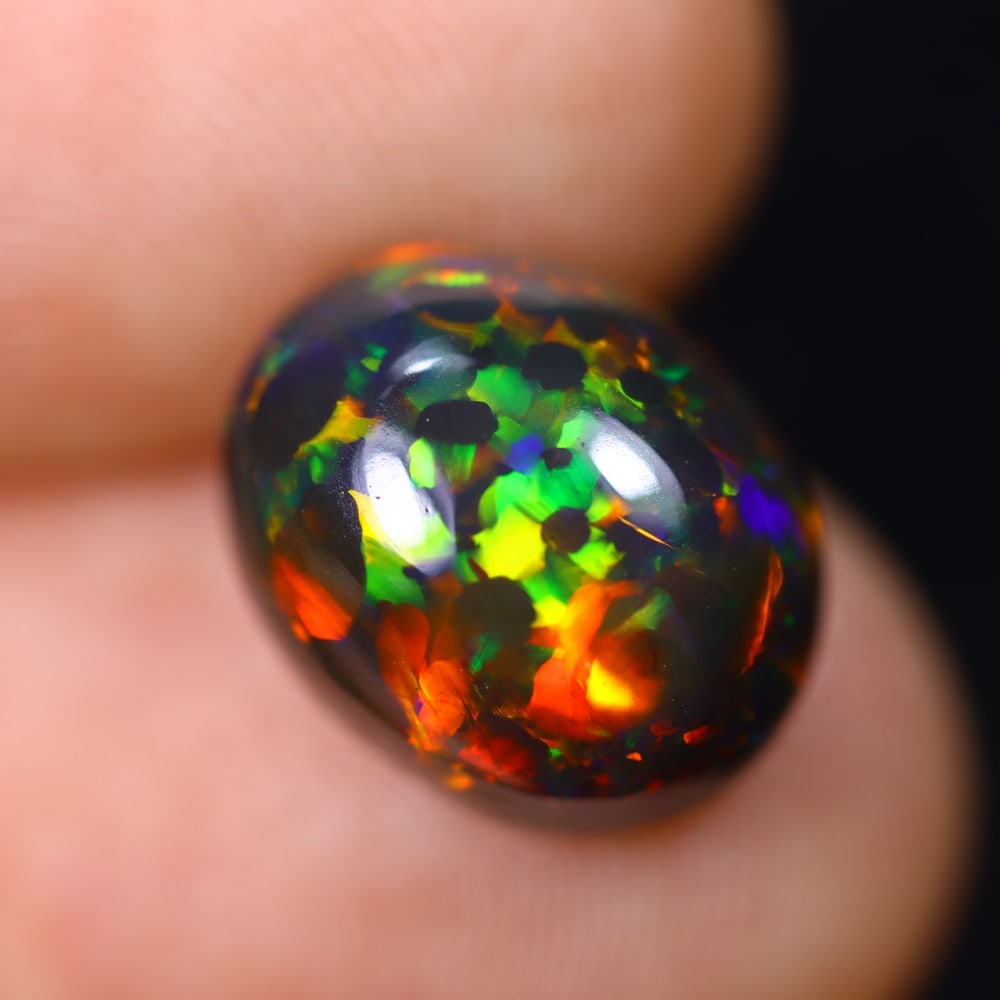 *3.03Ct Welo Black Opal Polished - Ethiopian Opal, 369B: Ksmith Heritage Auctioneers Subject: Natural Ethiopian Welo Black Opal Origin: Ethiopia Carat Weight: 3.03Ct Dimension: 11.8x9.4x5.2 mm Treatment: Smoked Type: Cabochon, Polish