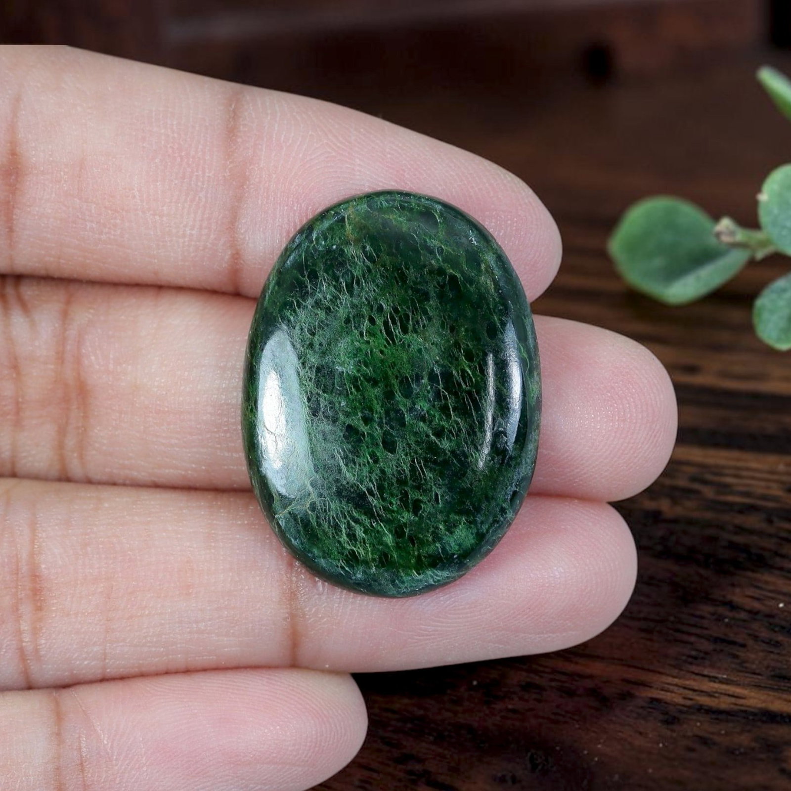 20.04ct Natural Burmese Type A Jadeite Jade Cabochon, 4EC: Fabricated from untreated natural Burmese Type A jadeite jade, this large oval cabochon is refined with glossy lapidary polish featuring a rounded domed face and flat base suited for bespoke pendant m