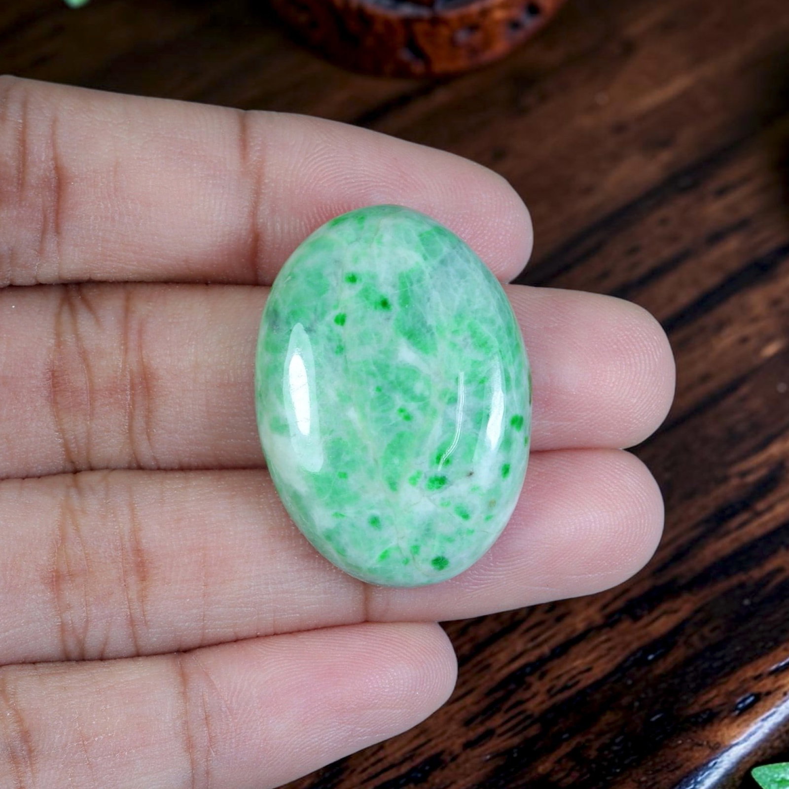 35.00ct Natural Burmese Type A Jadeite Jade Cabochon, 74EB: Polished from untreated natural Burmese Type A jadeite jade, this medium-large oval cabochon features a sleek domed polished surface paired with flat base designed for bespoke pendant mounting. Soft m