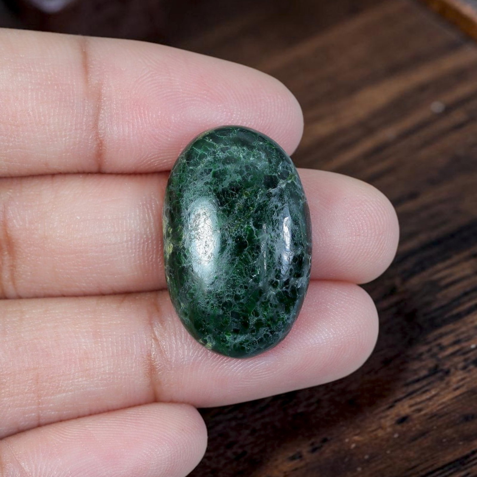 16.78ct Natural Burmese Type A Jadeite Jade Cabochon, 9EC: Polished from untreated natural Burmese Type A jadeite jade, this thick domed oval cabochon features high glossy finish and flat base for ring or pendant setting. Deep forest moss green main body is p