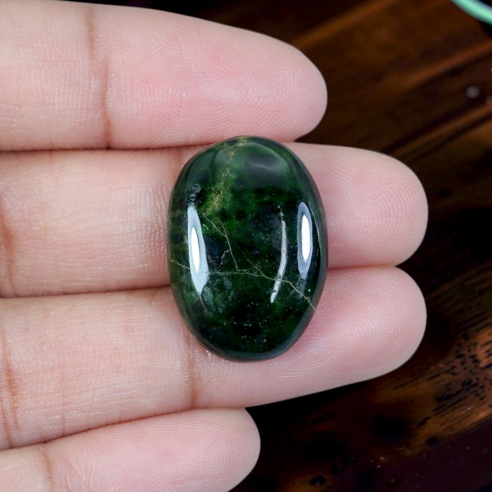 13.21ct Natural Burmese Type A Jadeite Jade Cabochon, 10EC: Polished from untreated natural Burmese Type A jadeite jade, this compact thick domed oval cabochon features glossy rounded dome and flat base designed for premium ring mounting. Deep translucent moss