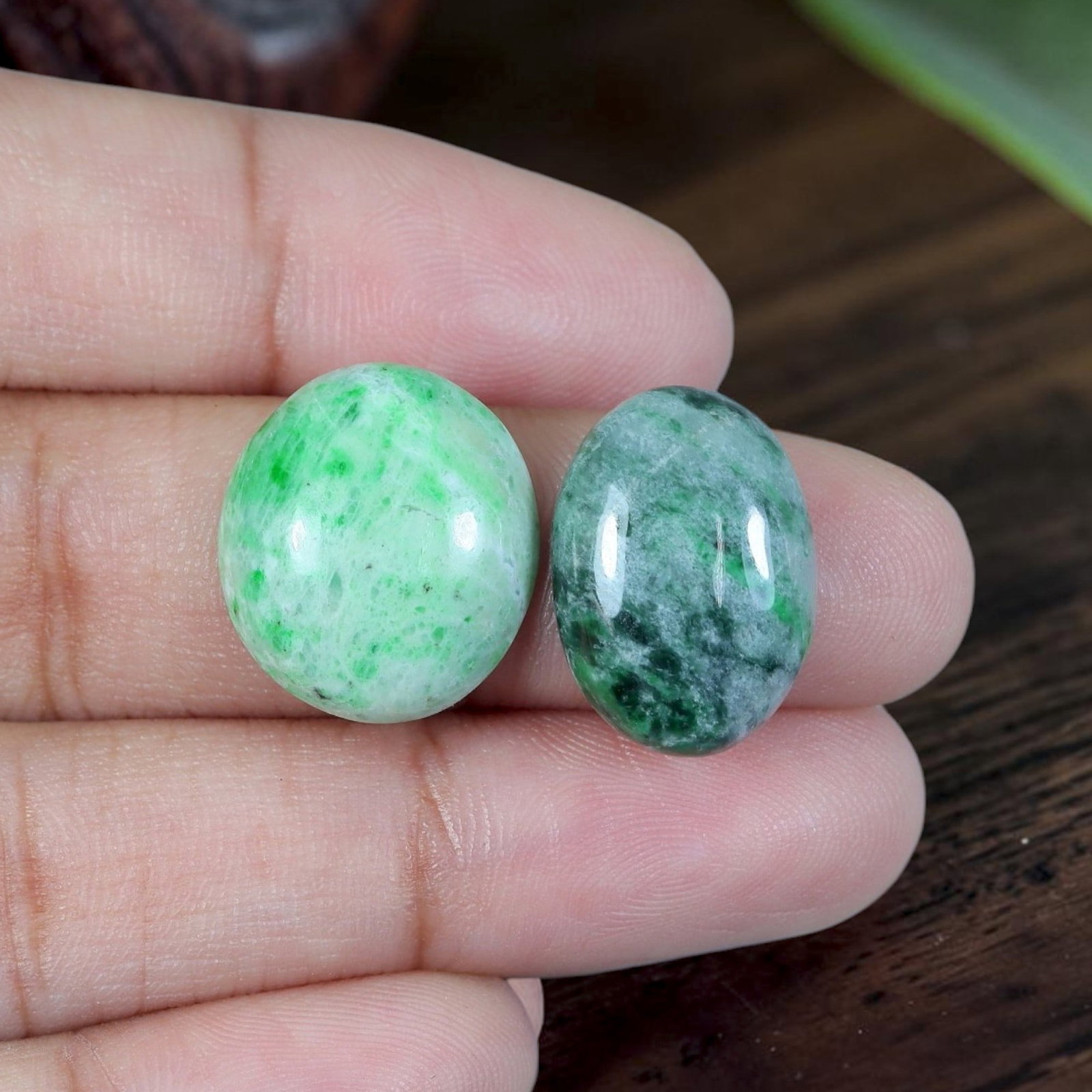 15.02ct Natural Burmese Type A Jadeite Jade Cabochon Pair, 13EC: Cut from untreated natural Burmese Type A jadeite jade, this matched pair of oval cabochons receives fine lapidary polish with rounded domed tops and flat bases tailored for earring mounting. The set 