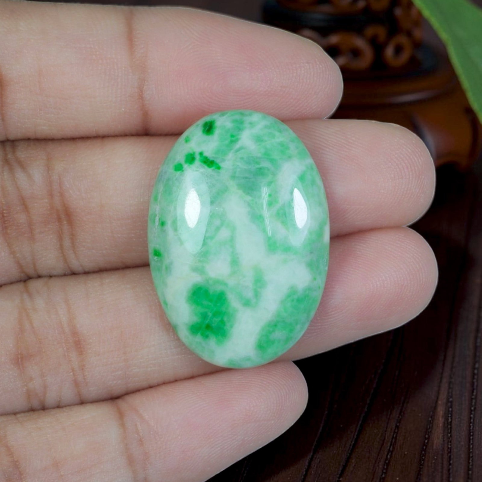 22.72ct Natural Burmese Type A Jadeite Jade Cabochon, 69EB: Polished from untreated natural Burmese Type A jadeite jade, this oval cabochon features a smoothly domed upper surface paired with flat base suited for custom pendant or ring setting. Bright opaque w