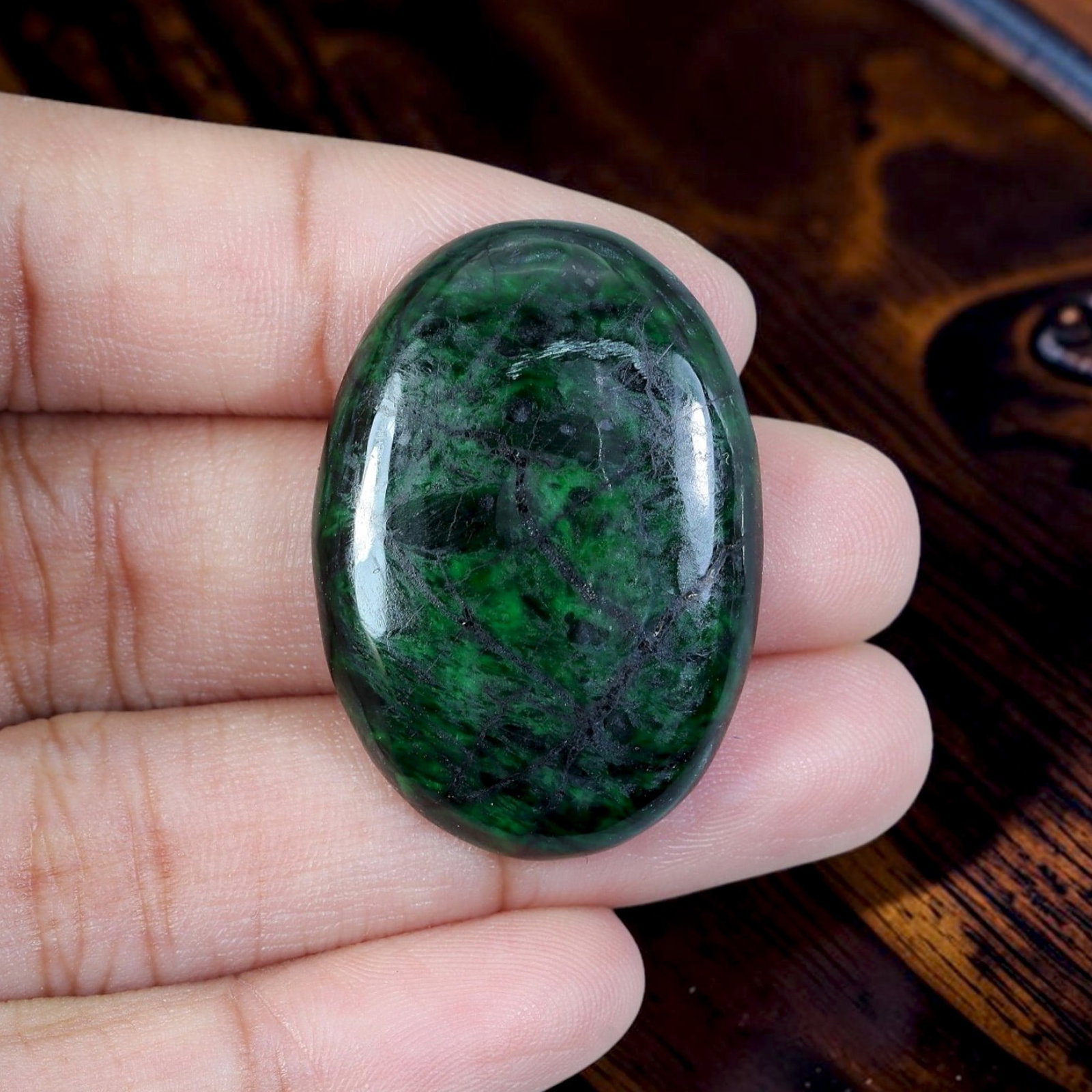 31.73ct Natural Burmese Type A Jadeite Jade Cabochon, 99EB: Polished from untreated natural Burmese Type A jadeite jade, this large oval domed cabochon features sleek glossy surface and thin flat base ideal for vintage statement pendant setting. Deep blackish 