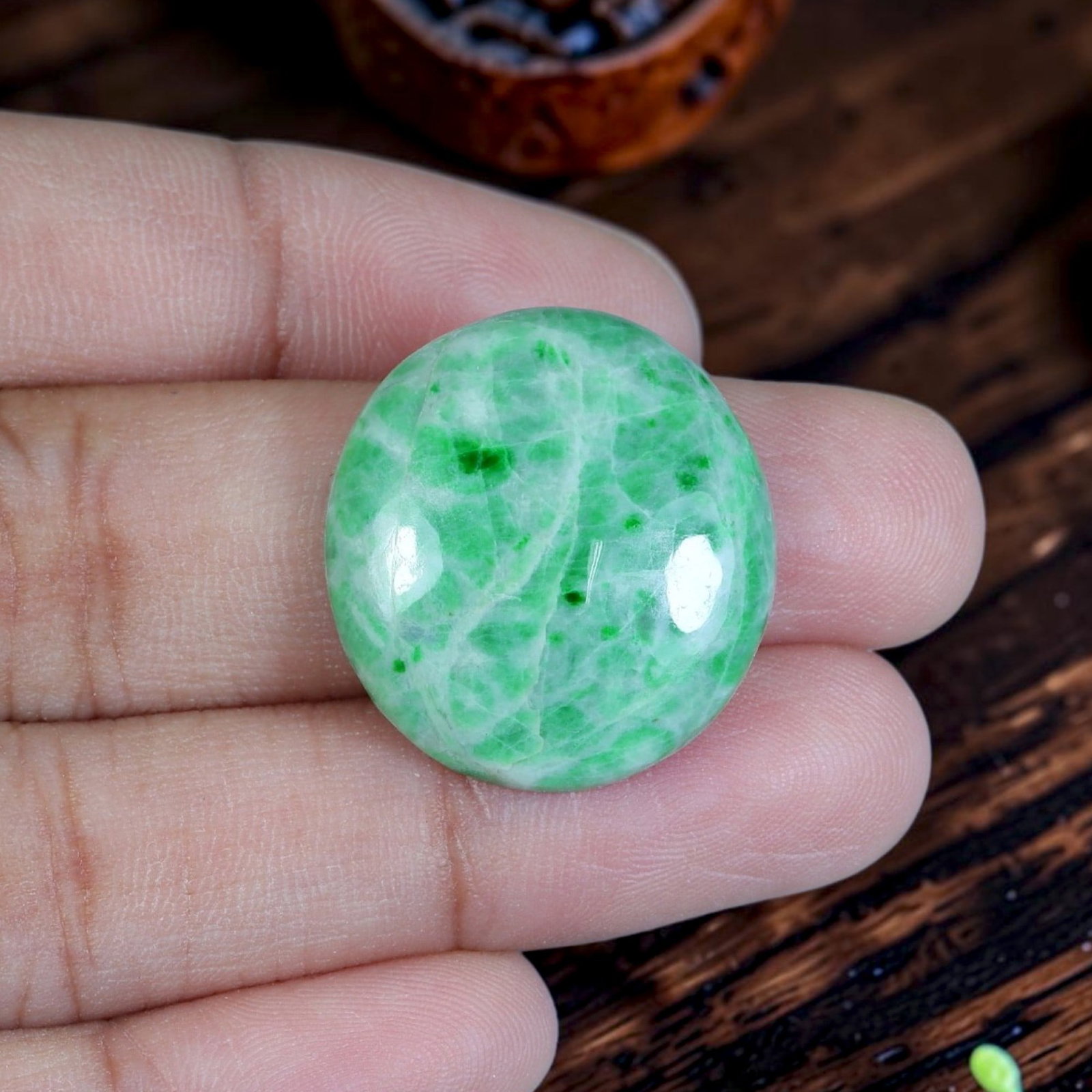 21.02ct Natural Burmese Type A Jadeite Jade Cabochon, 76EB: Crafted from untreated natural Burmese Type A jadeite jade, this rounded oval cabochon features smoothly domed polished surface and flat base suited for bespoke ring or pendant setting. Pale milky cel