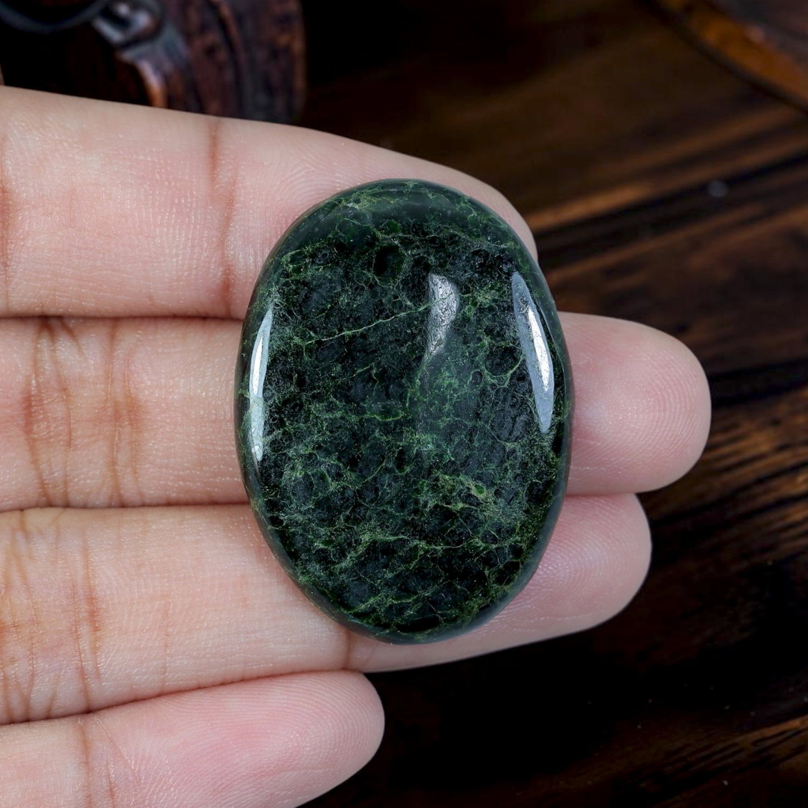 31.49ct Natural Burmese Type A Jadeite Jade Cabochon, 2EC: Polished from untreated natural Burmese Type A jadeite jade, this large thick domed oval cabochon carries bright glossy finish with flat base suited for oversized statement pendant mounting. Deep blac