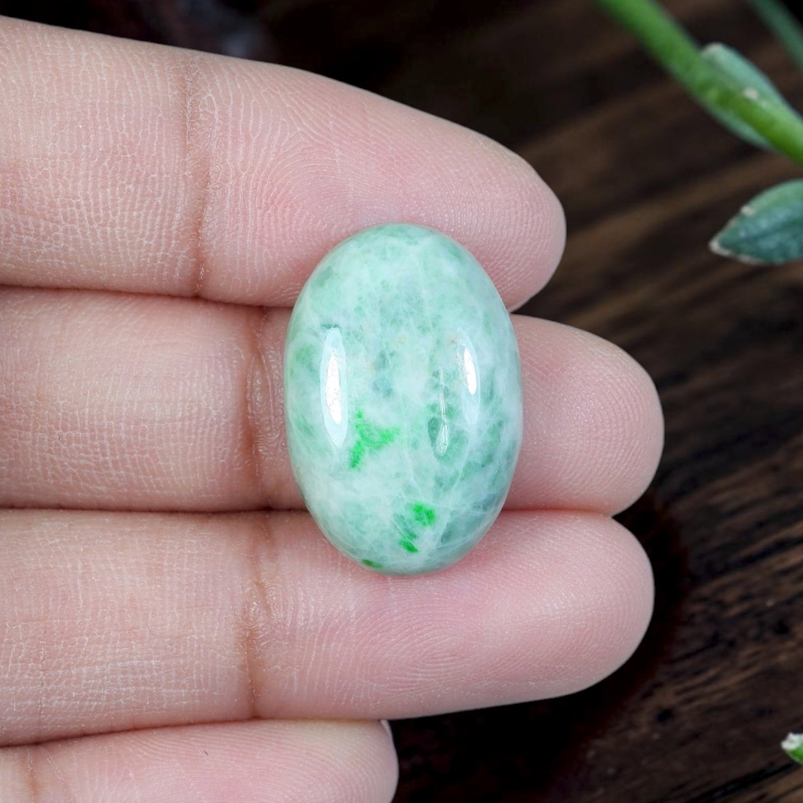 13.21ct Natural Burmese Type A Jadeite Jade Cabochon, 91EB: Polished from untreated natural Burmese Type A jadeite jade, this compact oval cabochon features smoothly domed top and flat base engineered for ring setting. Pale milky celadon base matrix bears a sm