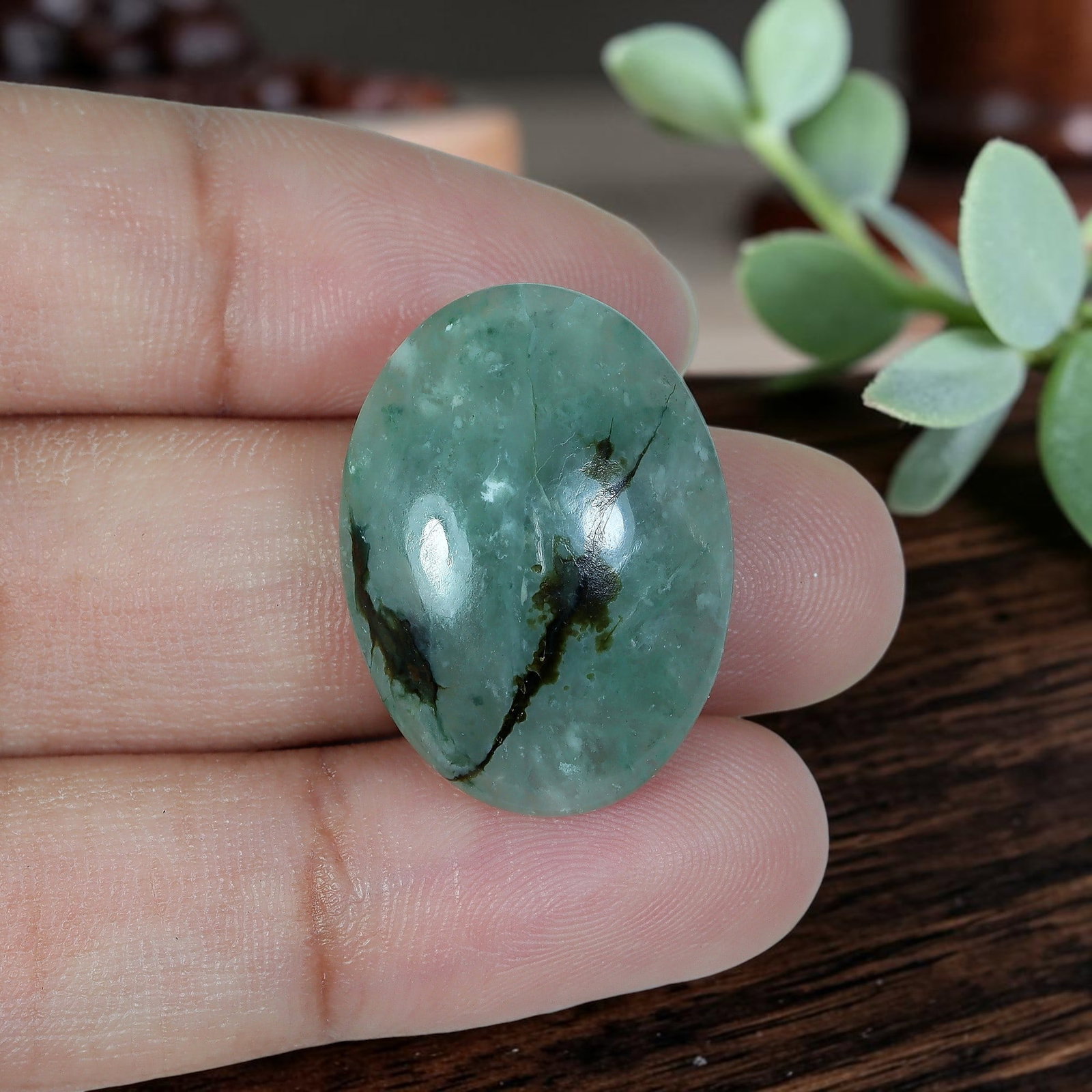 17.02ct Natural Burmese Type A Ice Green Dark Ink Streak Jadeite Jade Oval Cabochon, 3AR: Polished from fully untreated natural Burmese Type A jadeite jade, this well-proportioned oval cabochon features a plump rounded domed top with flat base, ideal for distinctive vertical fashion rings 