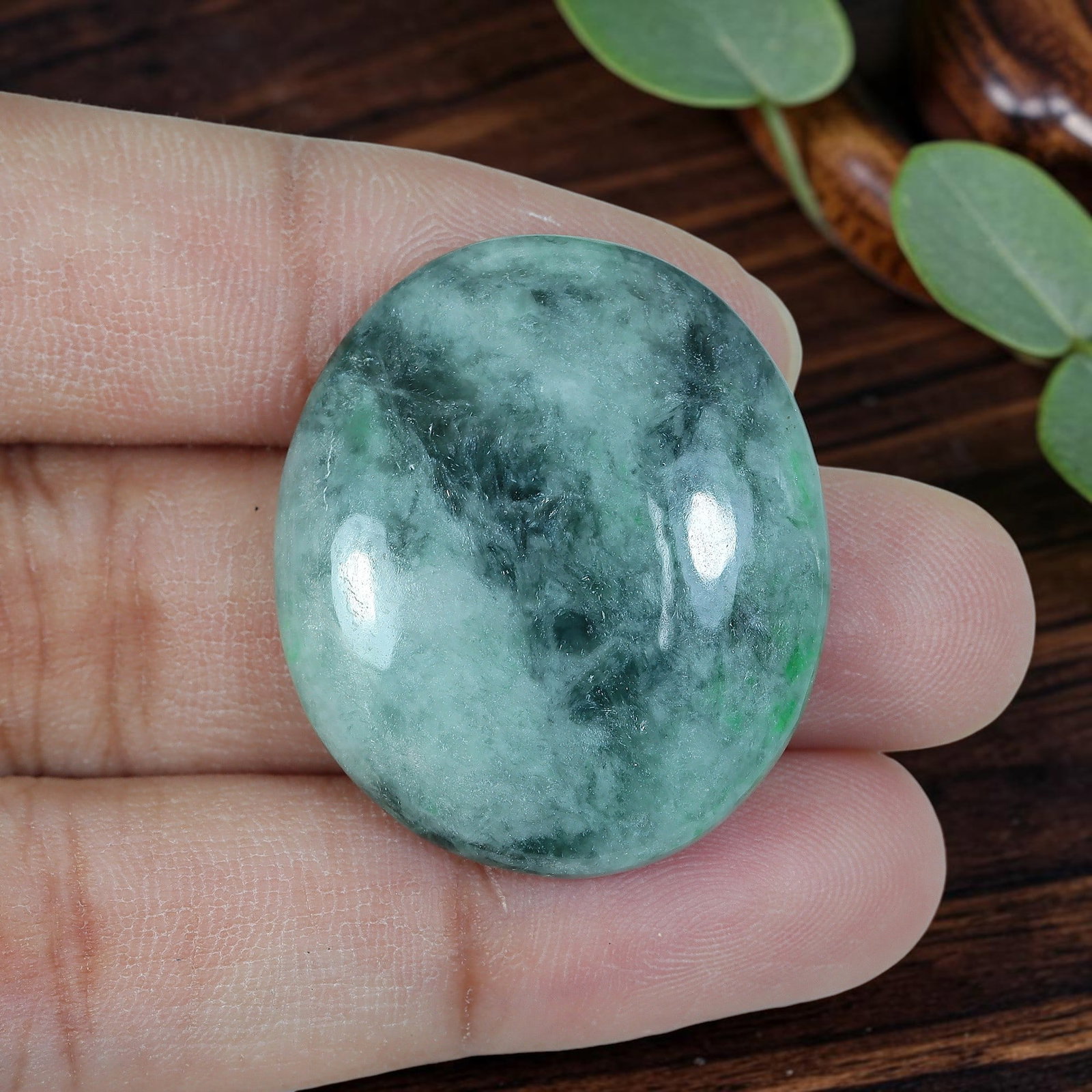 39.52ct Natural Burmese Type A Jadeite Jade Oval Cabochon, 91AP: Polished from untreated natural Burmese Type A jadeite jade, this oval cabochon features plump domed polish and flat base suitable for large statement pendant mounting. Translucent pale mint green bas