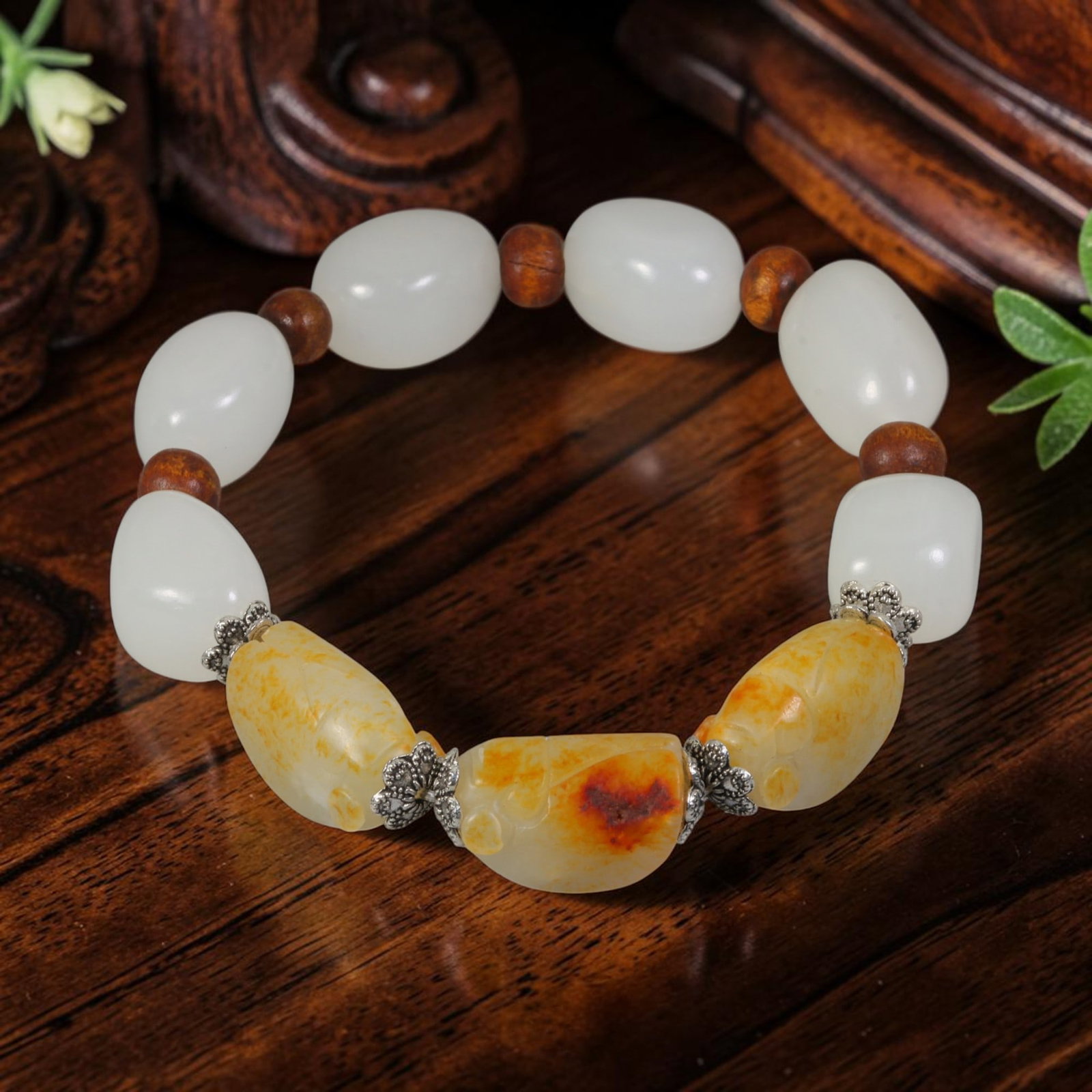 Chinese Hetian Nephrite Seed Pebble Mixed Carved & Uncarved Jade Beaded Bracelet, 72AR: This handcrafted bracelet combines smooth uncarved natural Hetian nephrite seed pebbles and three elaborately carved russet-skin nephrite focal pieces. The unworked river-worn milky white seed jade be
