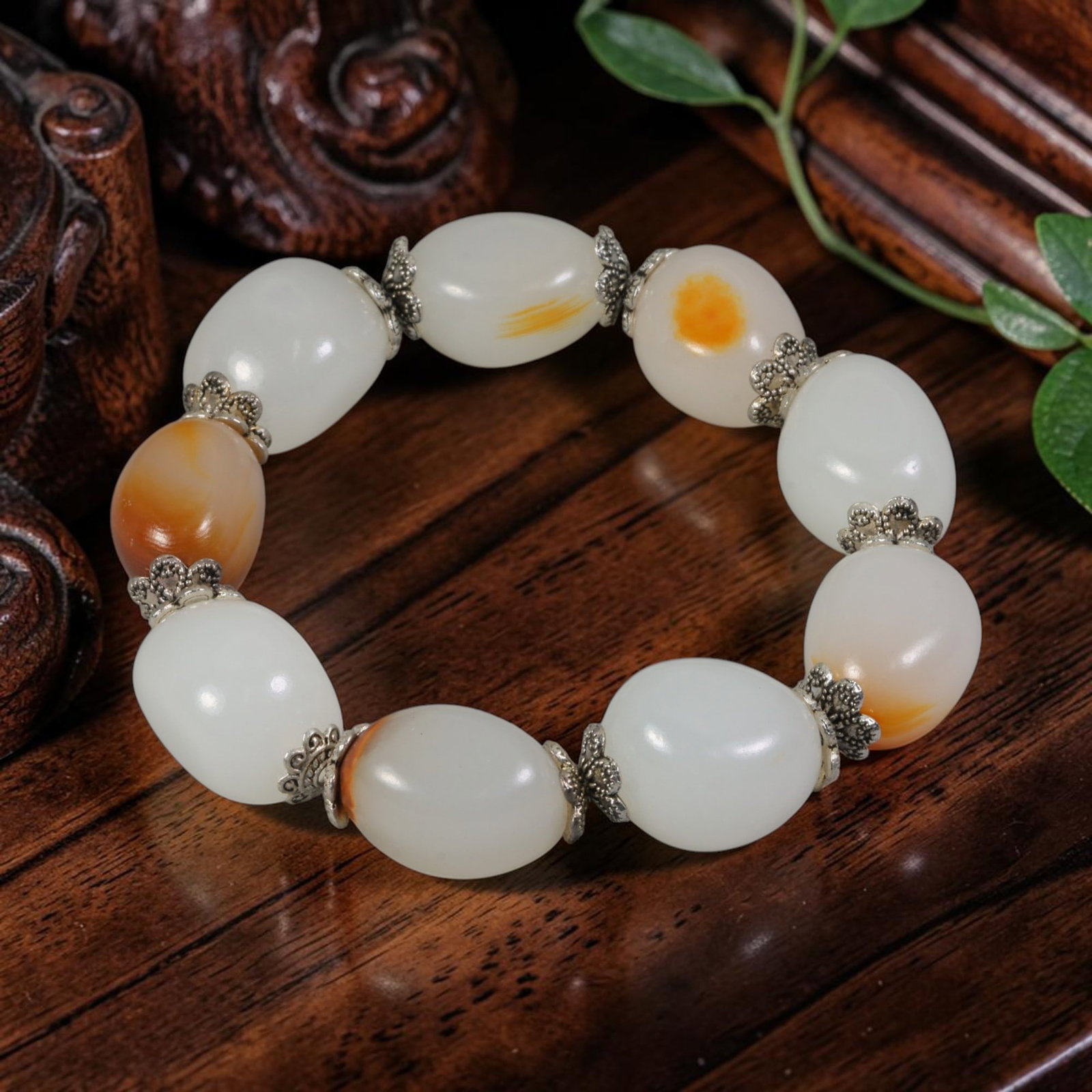 Chinese Hetian White Nephrite Seed Pebble Bracelet With Russet Skin & Silver Floral Spacers, 82AR: This bracelet is crafted from natural uncarved Hetian nephrite river seed pebbles with smooth organic oval silhouettes and creamy milky white base tone, highlighted by scattered natural orange russet 