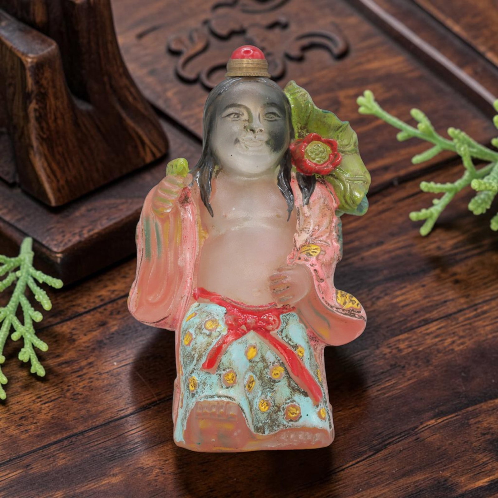 Vintage Chinese Painted Liuli Snuff Bottle - Girl Figurine, 78YF: Crafted from translucent green liuli glass, this vintage Chinese snuff bottle is modelled as a standing girl figure holding a covered vessel. The glass body is hand-painted in vibrant colours: the fig